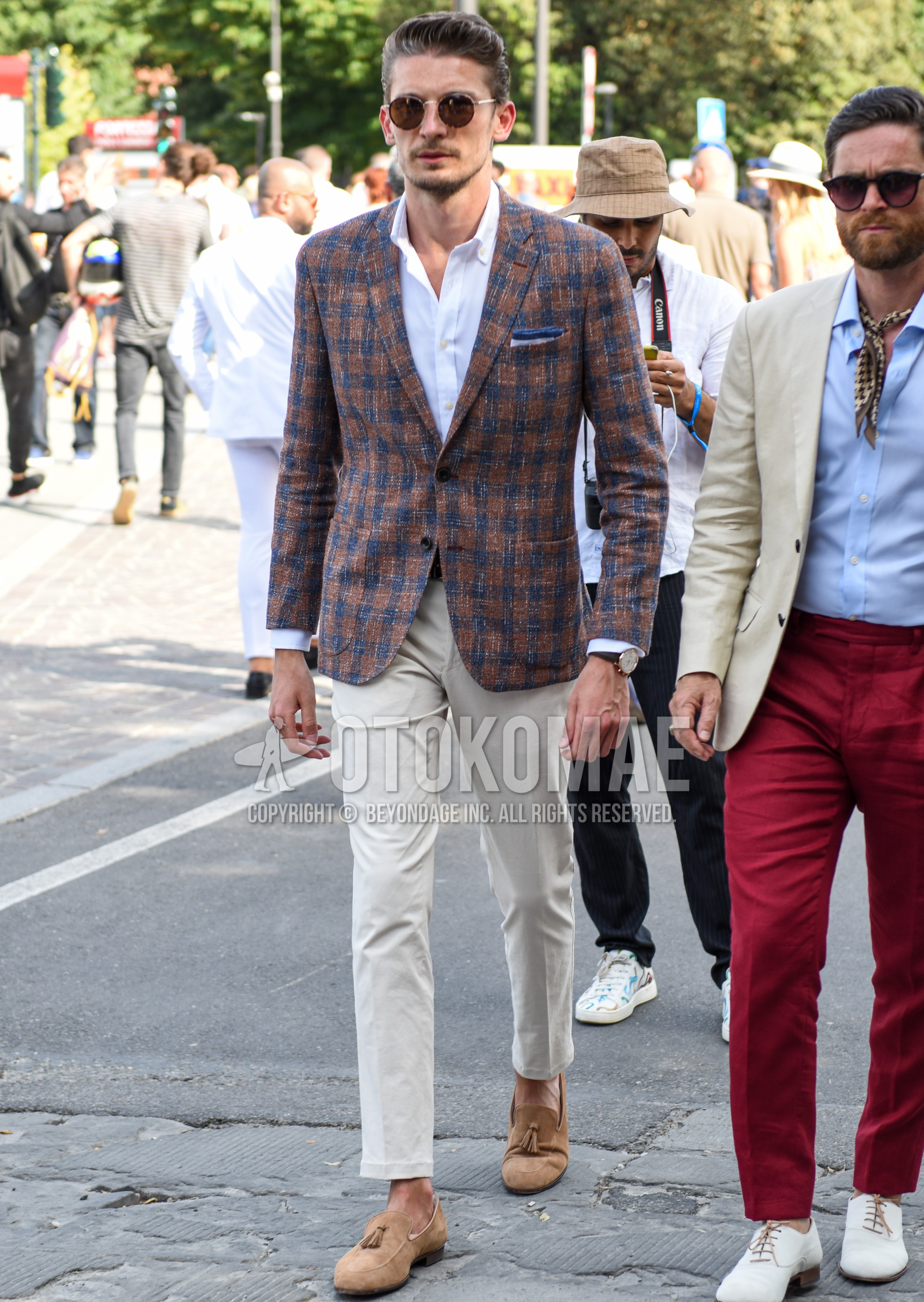 Men's spring summer autumn outfit with brown plain sunglasses, brown blue check tailored jacket, white plain shirt, white plain cotton pants, brown tassel loafers leather shoes.