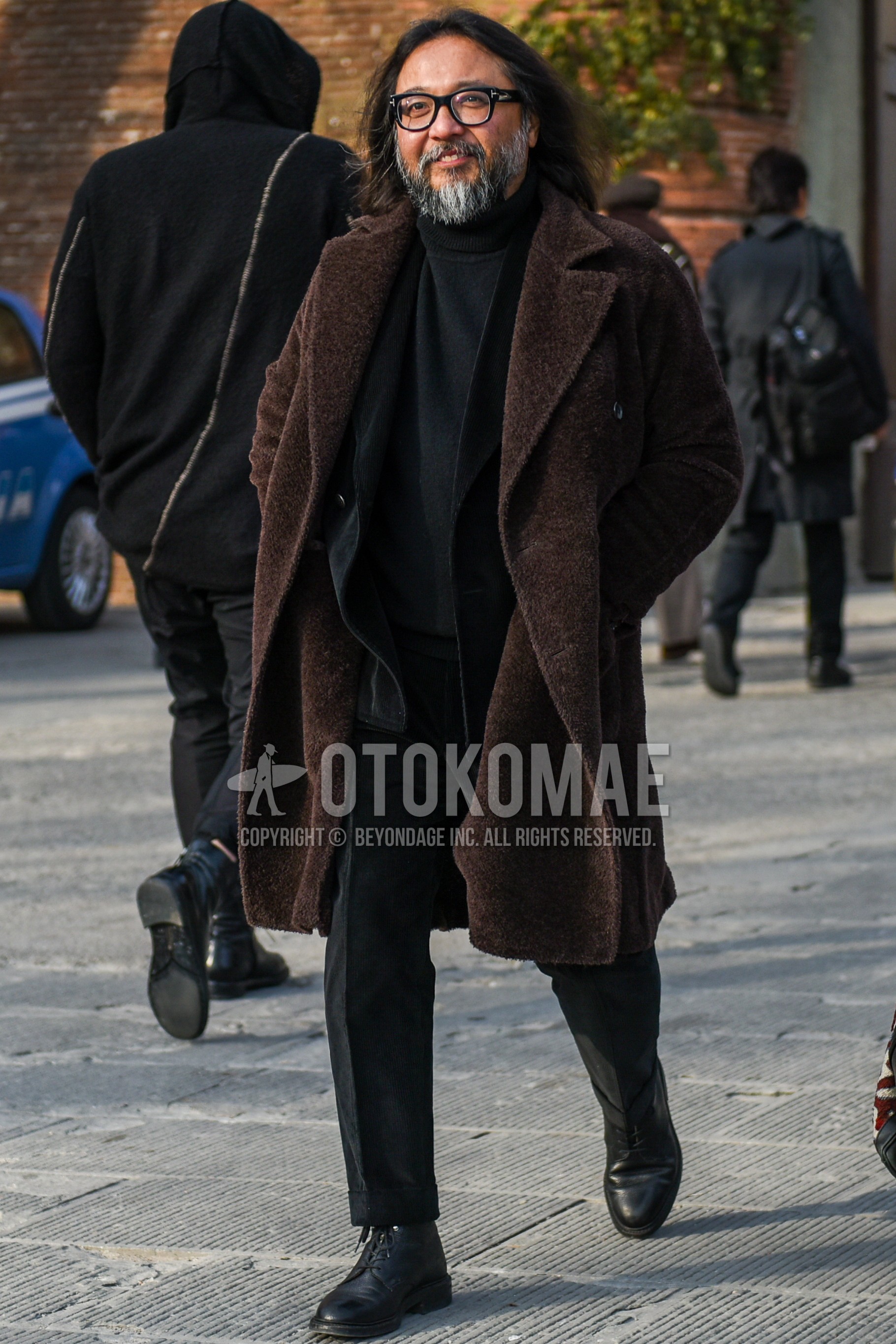 Men's autumn winter outfit with black plain glasses, brown plain chester coat, black plain turtleneck knit, black  boots, black plain suit.
