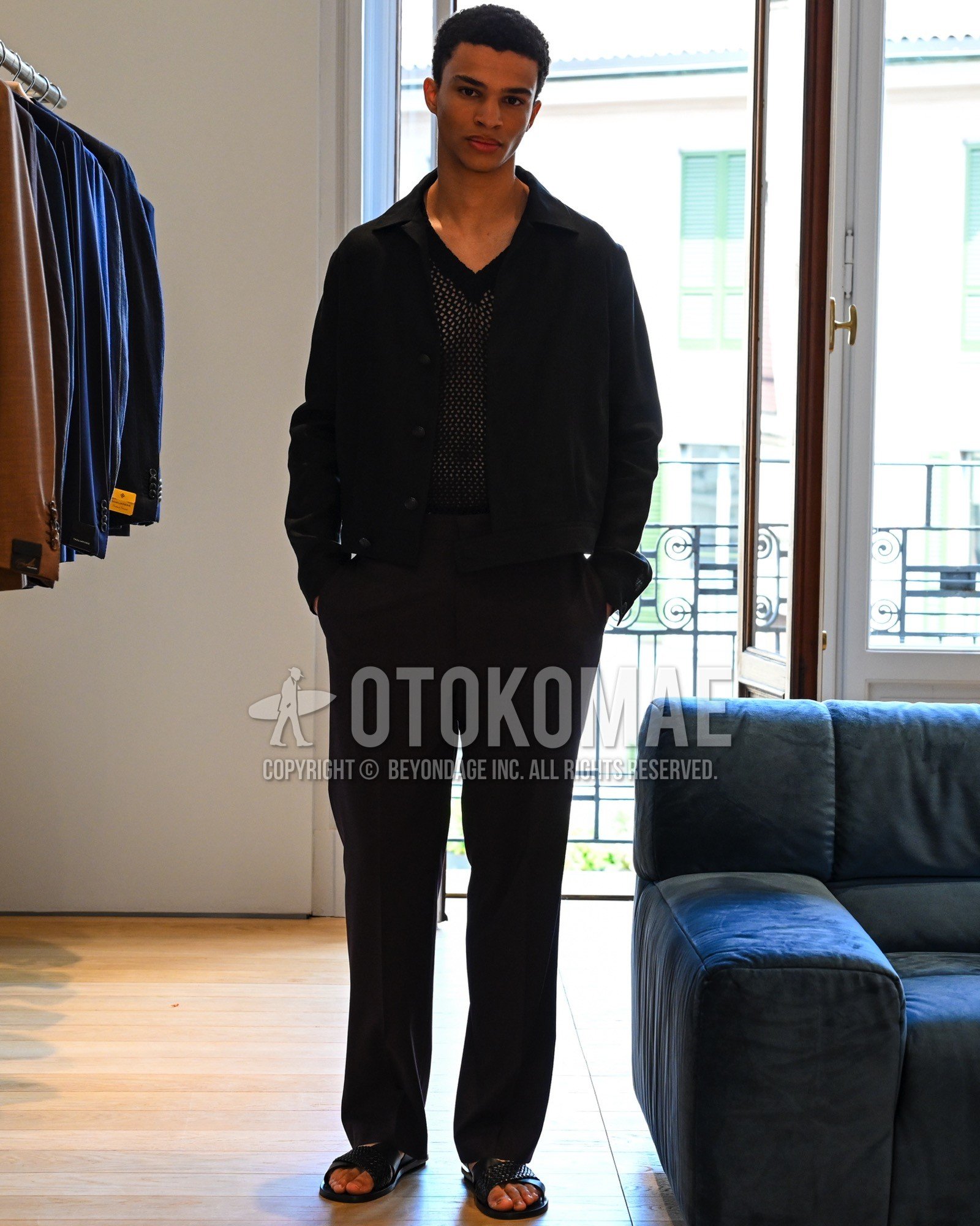 Men's spring summer autumn outfit with black plain coverall, black plain t-shirt, black plain slacks, black shower sandals.
