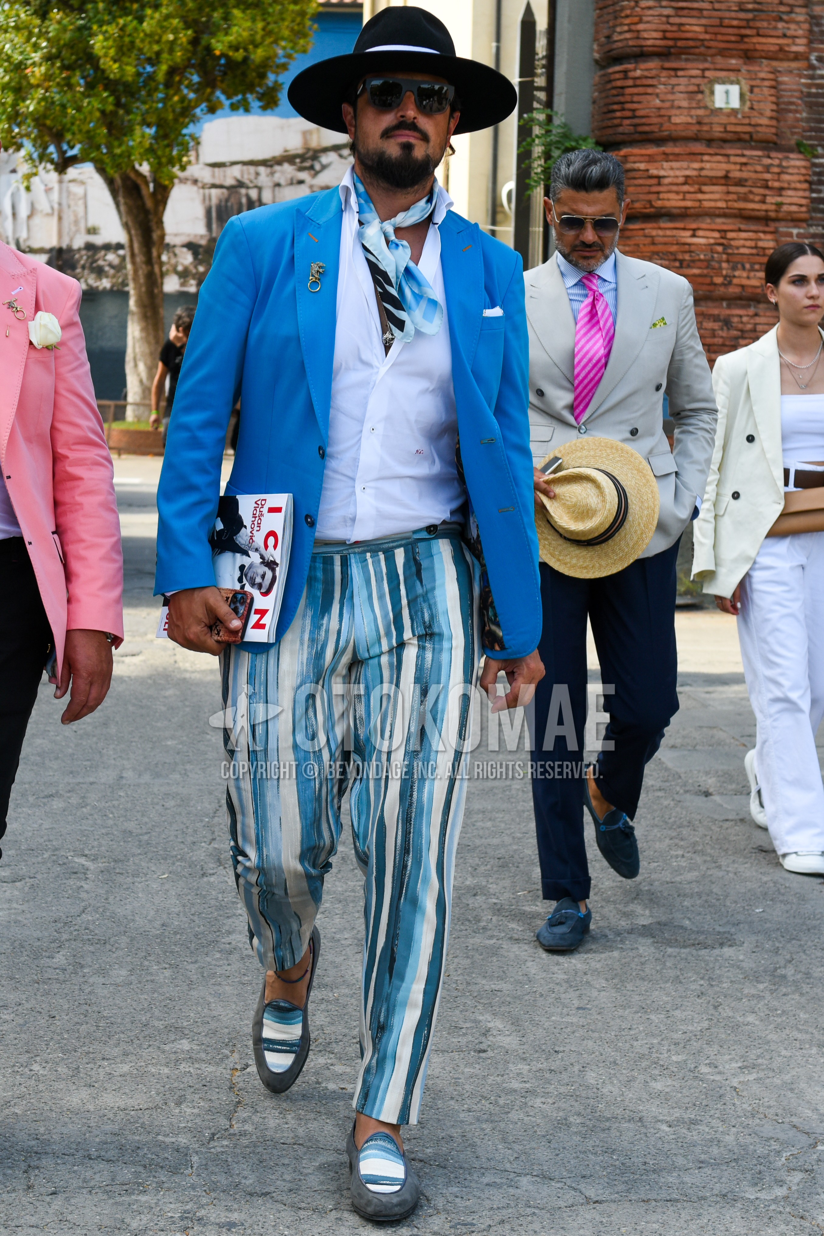 Men's spring summer outfit with black plain hat, black plain sunglasses, white light blue scarf scarf, light blue plain tailored jacket, white plain shirt, light blue white stripes slacks, light blue white stripes cropped pants, gray  loafers leather shoes.