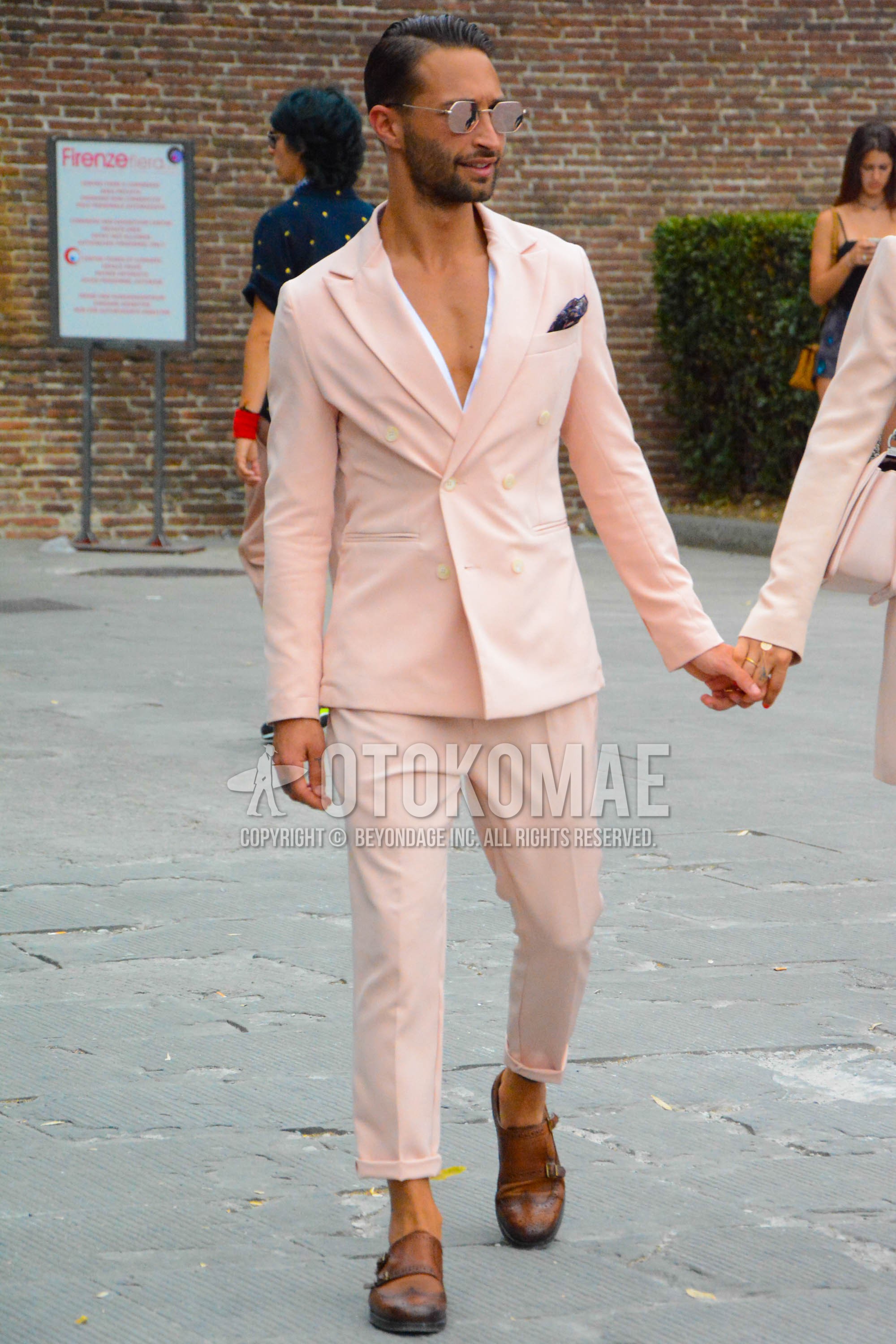 Men's spring summer outfit with silver plain sunglasses, brown monk shoes leather shoes, pink plain suit.