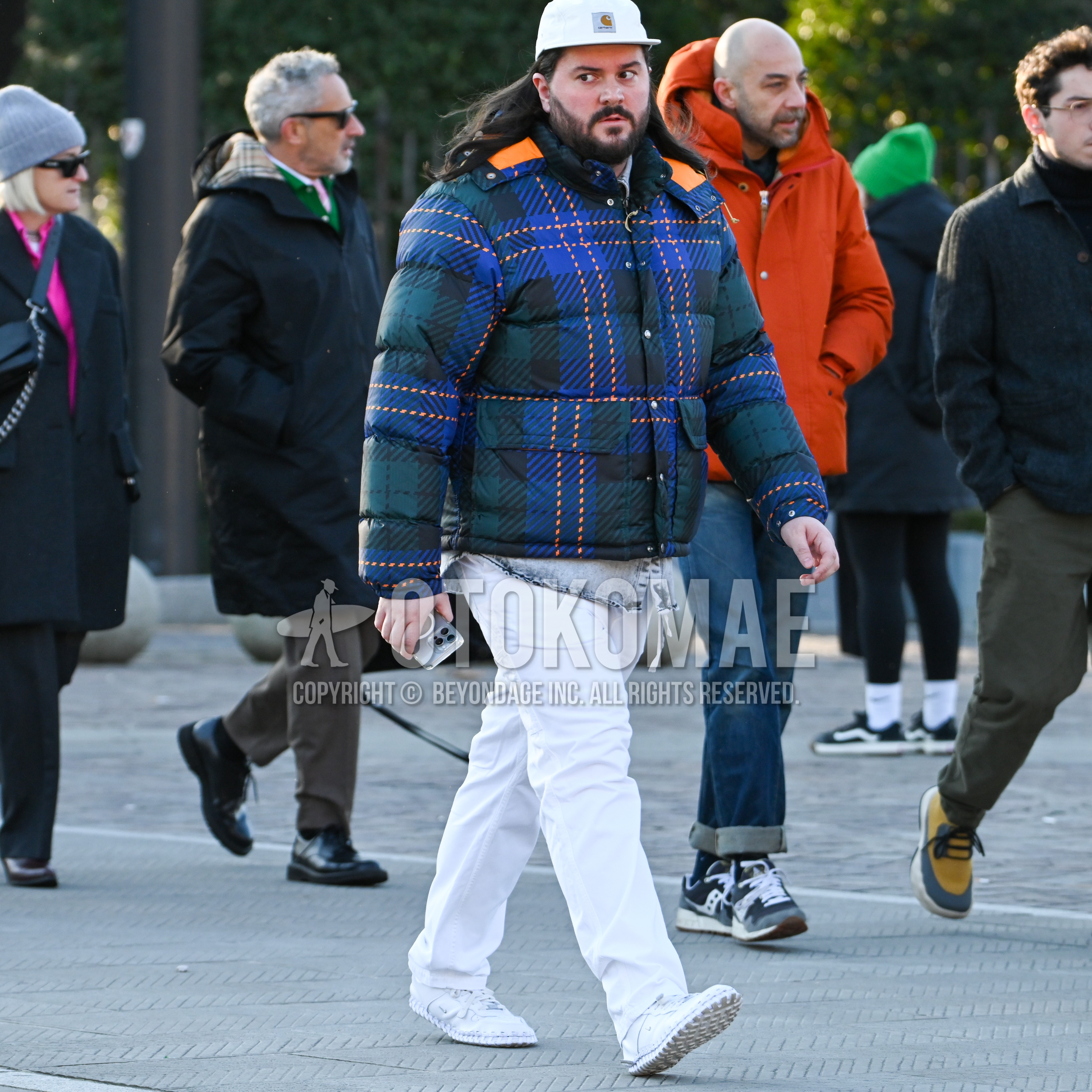 Men's autumn winter outfit with white one point baseball cap, multi-color check down jacket, gray plain denim shirt/chambray shirt, white plain cotton pants, white low-cut sneakers.