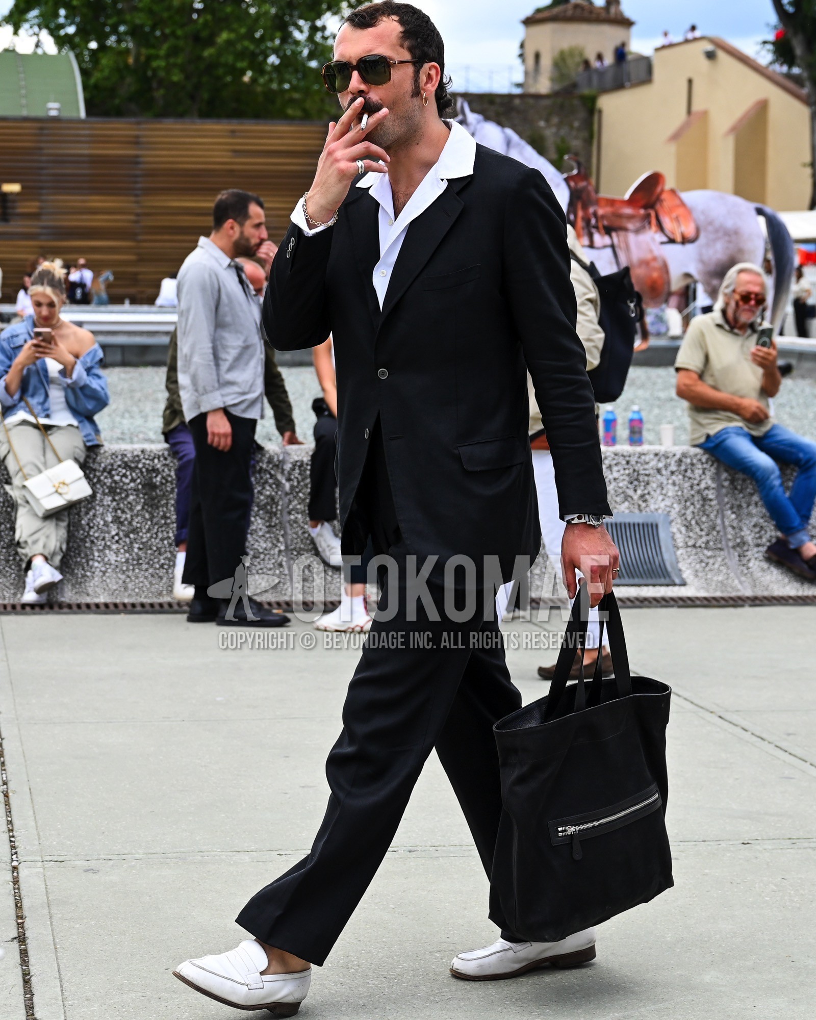 Men's spring summer autumn outfit with black plain sunglasses, white plain shirt, white coin loafers leather shoes, black plain tote bag, black plain suit.
