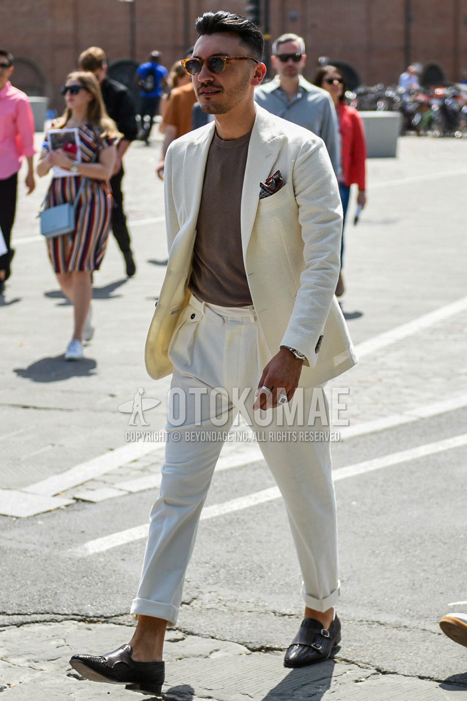 Men's spring autumn outfit with brown tortoiseshell sunglasses, brown plain t-shirt, brown monk shoes leather shoes, white plain suit.
