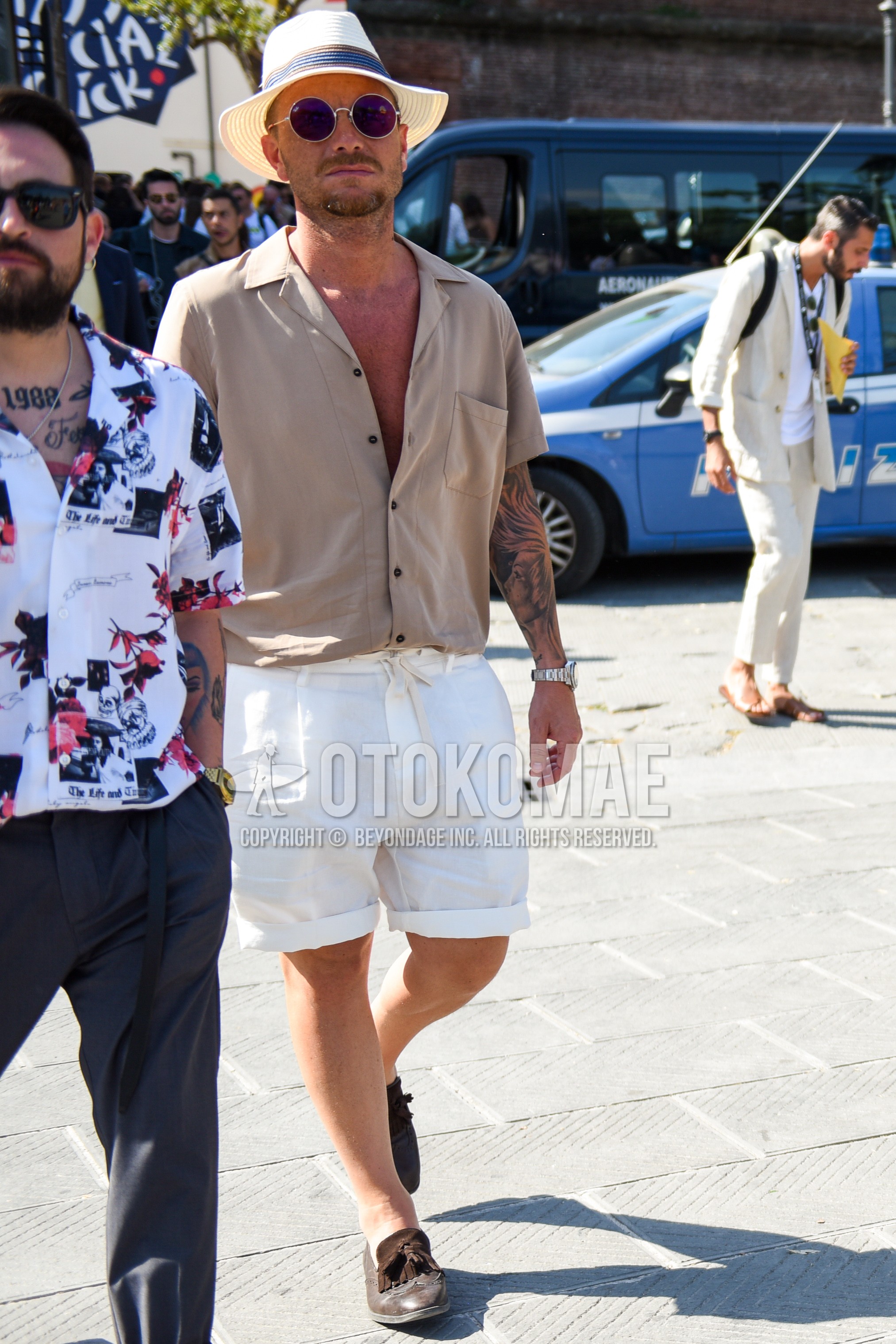 Men's summer outfit with white plain hat, silver plain sunglasses, beige plain shirt, white plain short pants, brown tassel loafers leather shoes.