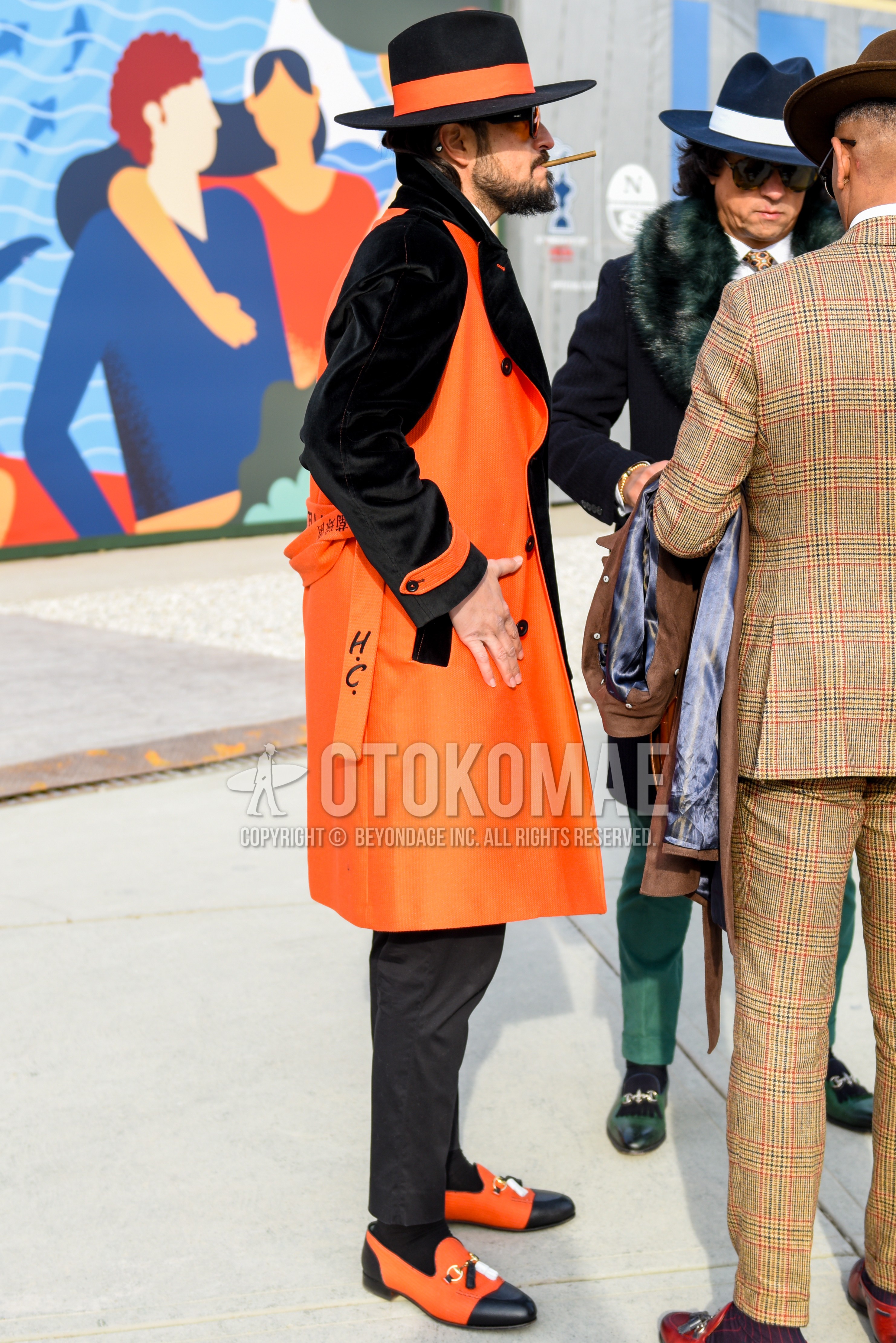 Men's autumn winter outfit with black plain hat, black plain sunglasses, black orange plain outerwear, gray plain slacks, gray plain ankle pants, black orange bit loafers leather shoes.