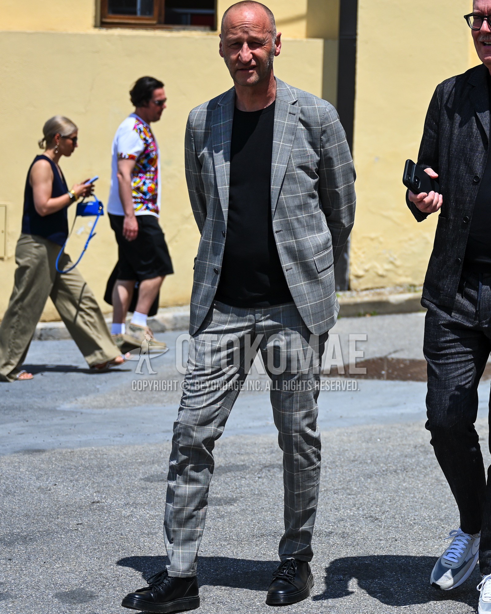 Men's spring summer autumn outfit with black plain t-shirt, black high-cut sneakers, gray check suit.