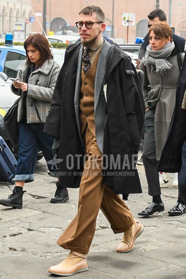 Men's winter outfit with plain glasses, black plain hooded coat, brown plain shirt, gray plain tailored jacket, brown plain gilet, brown plain slacks, brown high-cut sneakers, brown dots necktie.