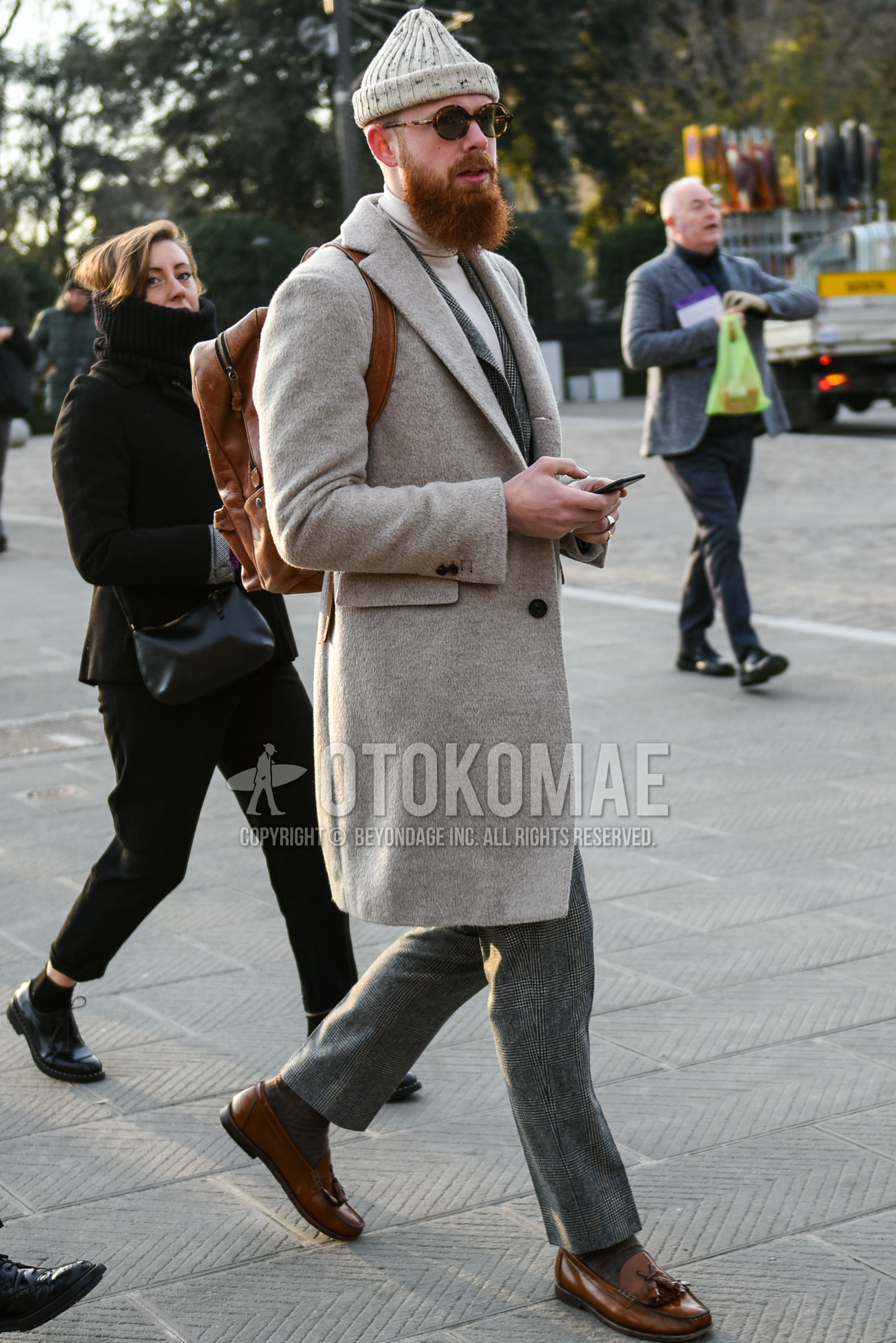 Men's autumn winter outfit with white plain knit cap, brown tortoiseshell sunglasses, gray plain chester coat, white plain turtleneck knit, gray plain socks, brown tassel loafers leather shoes, brown plain backpack, gray check suit.
