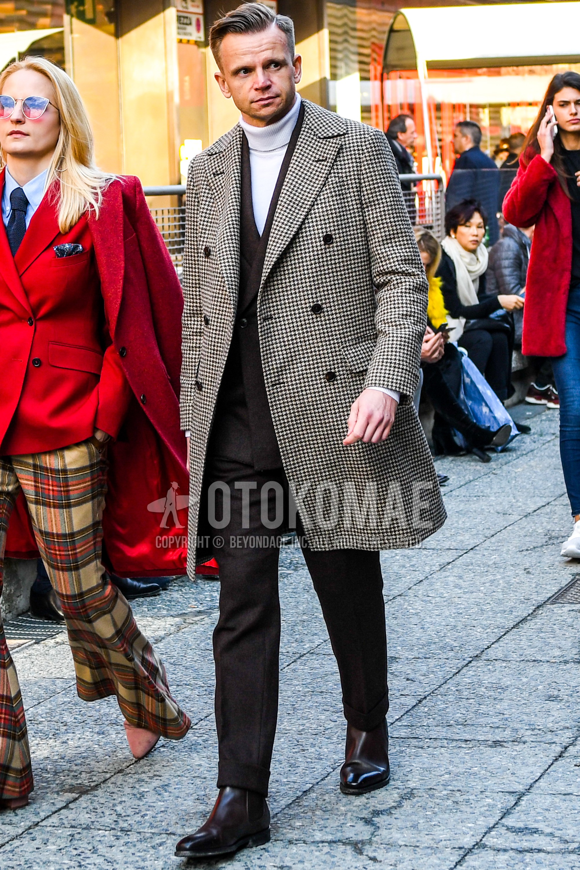 Men's autumn winter outfit with beige brown check chester coat, white plain turtleneck knit, brown side-gore boots, brown plain suit.