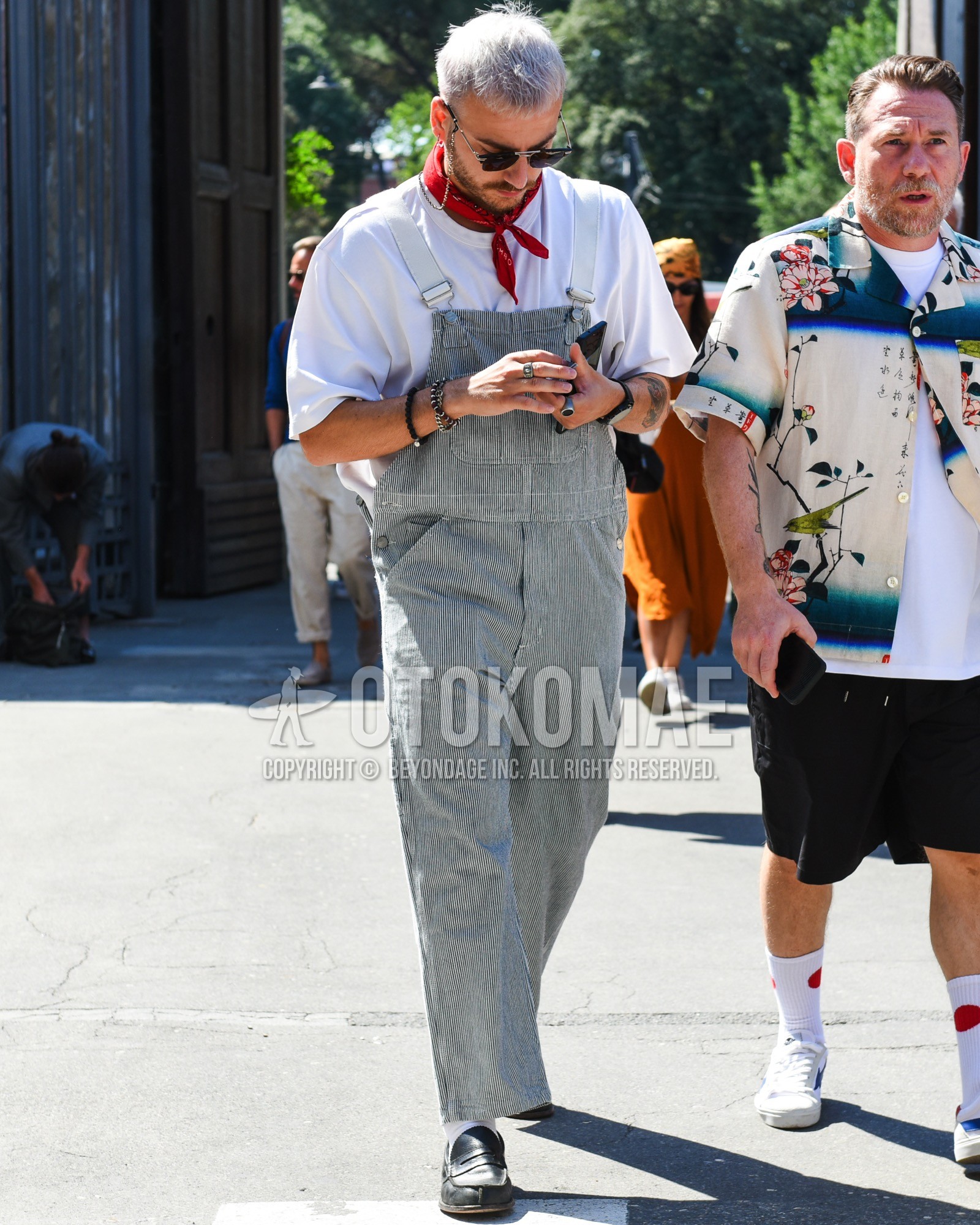 Men's spring summer outfit with silver plain sunglasses, red paisley bandana/neckerchief, gray stripes coverall, white plain t-shirt, white plain socks, black coin loafers leather shoes.