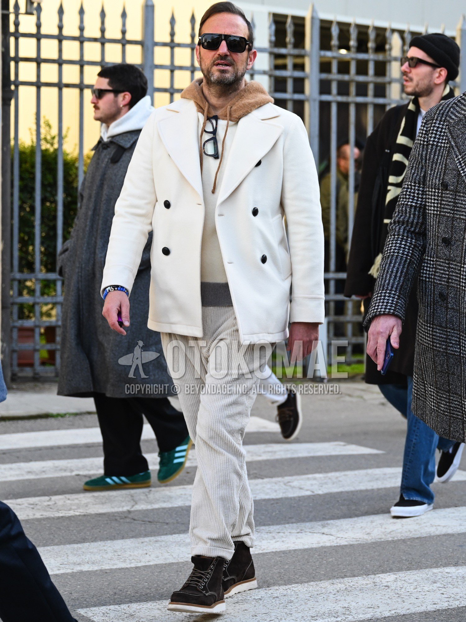 Men's autumn winter outfit with black plain sunglasses, white plain tailored jacket, white plain hoodie, white plain winter pants (corduroy,velour), brown work boots.