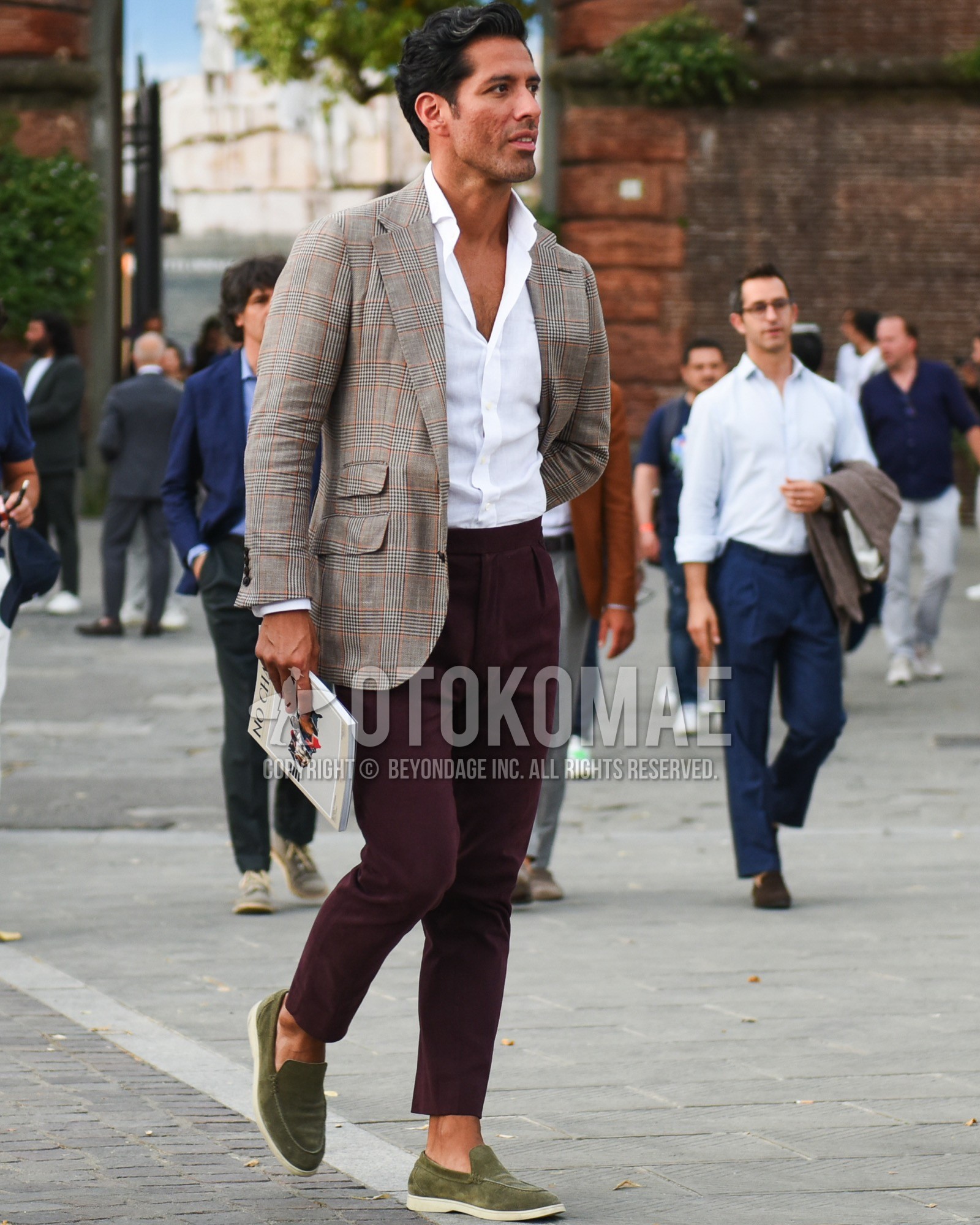Men's spring summer outfit with gray check tailored jacket, white plain shirt, red plain slacks, red plain cropped pants, olive green slip-on sneakers.
