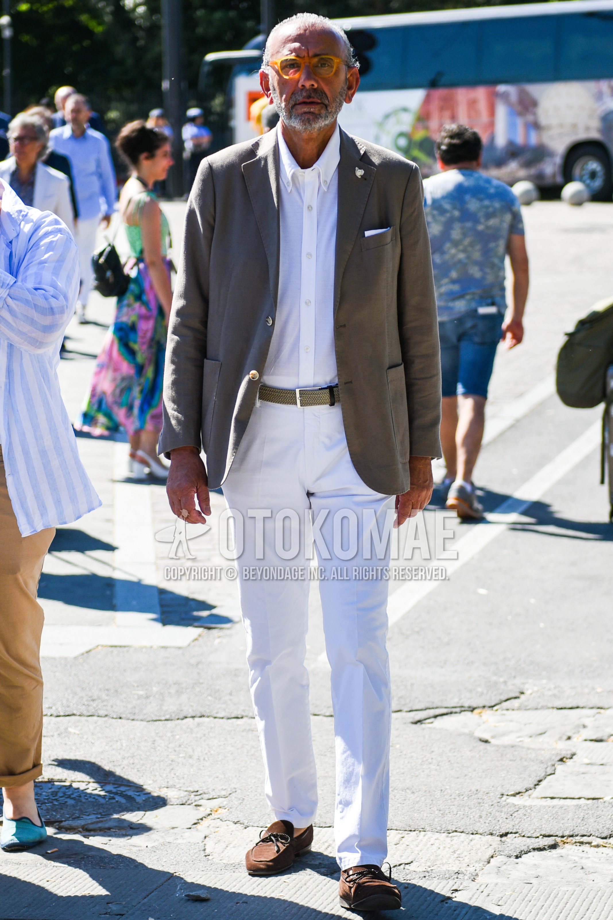 Men's spring summer autumn outfit with yellow plain glasses, gray plain tailored jacket, white plain shirt, beige plain braided belt, white plain cotton pants, brown moccasins/deck shoes leather shoes.