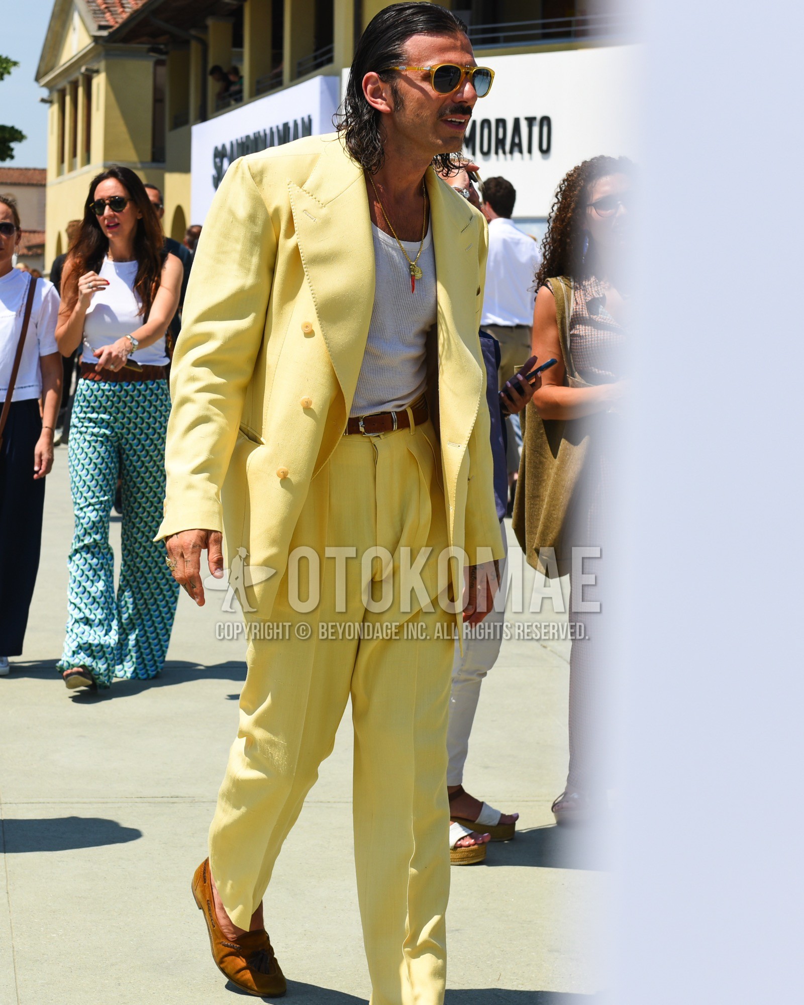 Men's spring summer outfit with yellow plain sunglasses, white plain tank top, brown plain leather belt, brown tassel loafers leather shoes, yellow plain suit.