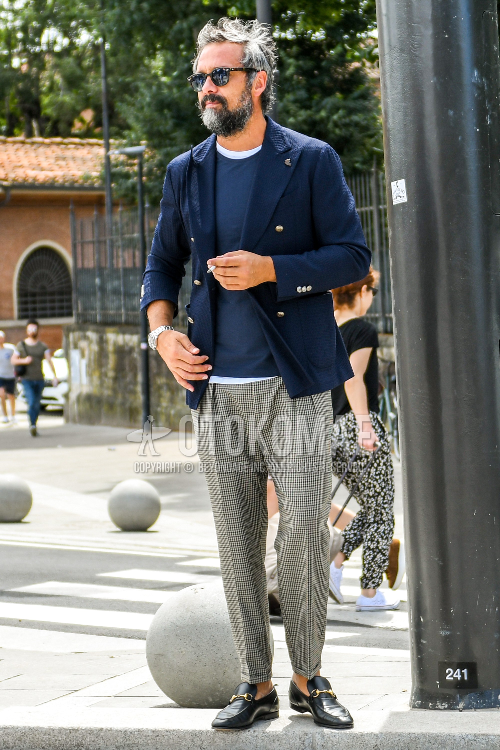 Men's spring summer autumn outfit with plain sunglasses, navy plain tailored jacket, navy plain t-shirt, white plain t-shirt, gray check ankle pants, gray check pleated pants, black bit loafers leather shoes.