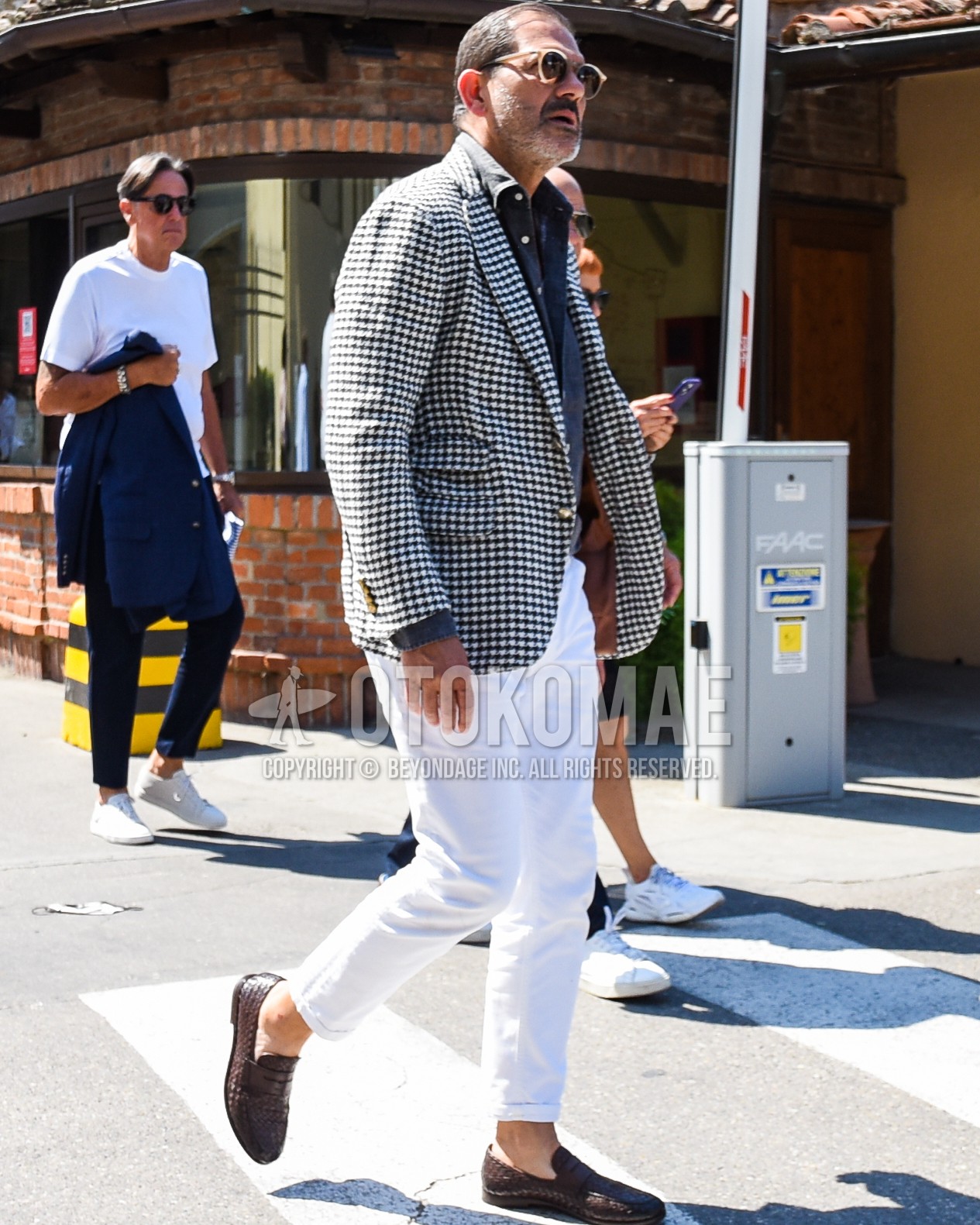 Men's spring summer autumn outfit with black plain sunglasses, black white check tailored jacket, dark gray plain shirt, white plain cotton pants, brown coin loafers leather shoes.