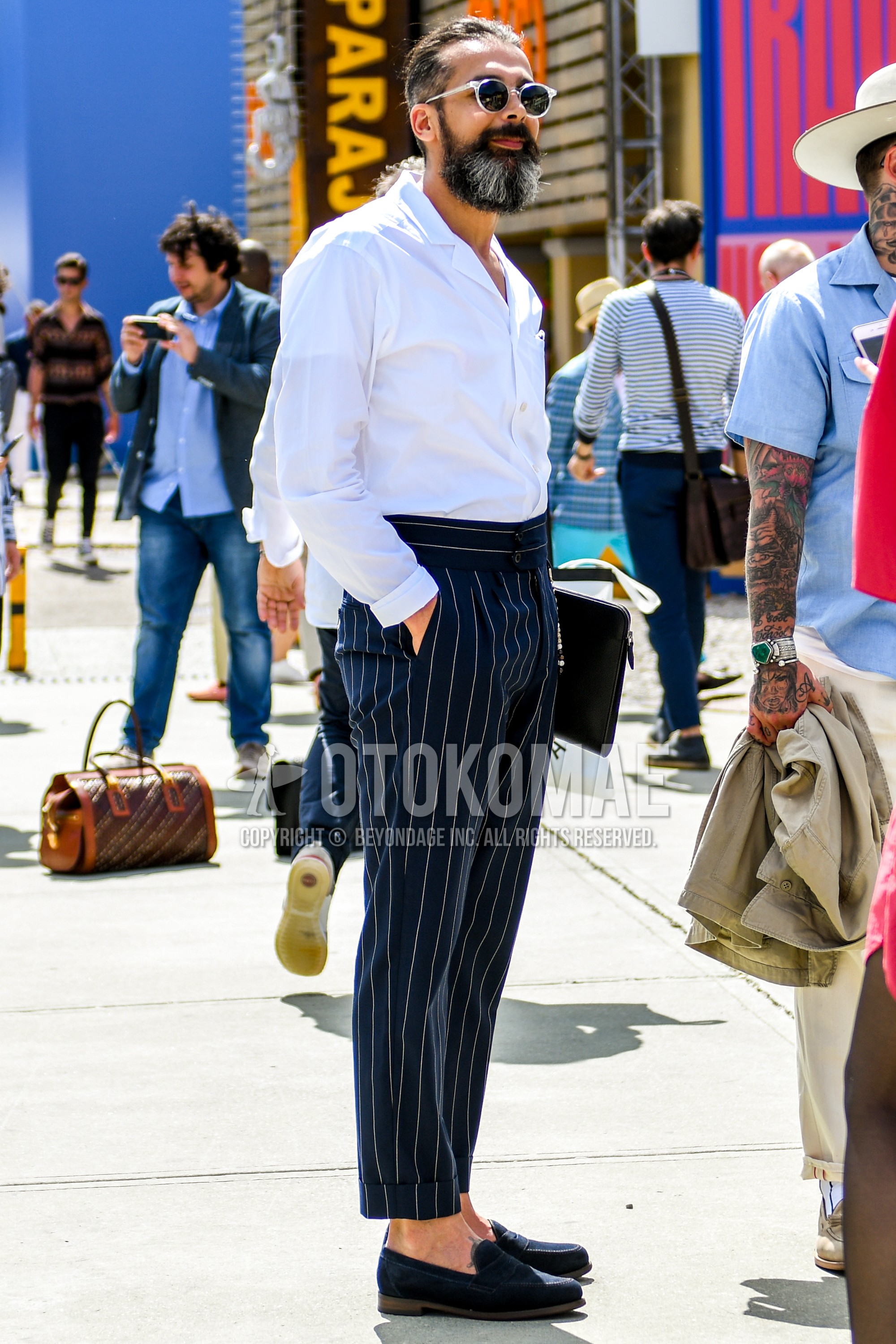 Men's spring summer outfit with plain sunglasses, white plain shirt, navy stripes slacks, navy coin loafers leather shoes.