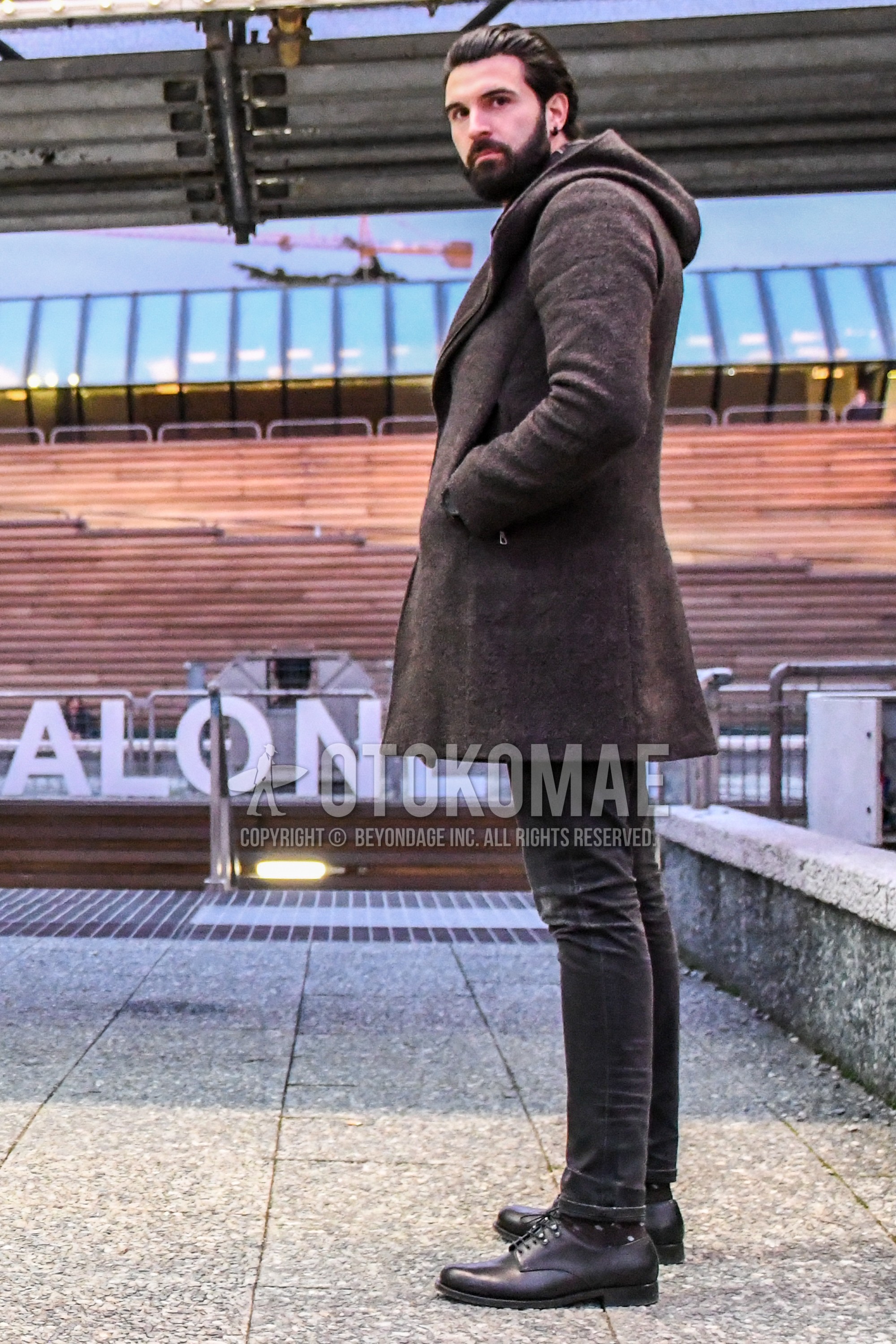 Men's winter outfit with brown plain hooded coat, dark gray plain denim/jeans, dark gray plain toe leather shoes.
