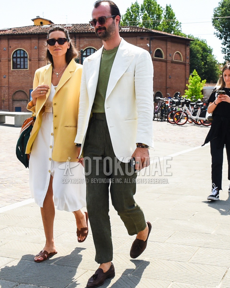 Men's spring summer outfit with brown plain sunglasses, white plain tailored jacket, green plain t-shirt, olive green plain slacks, brown tassel loafers leather shoes.