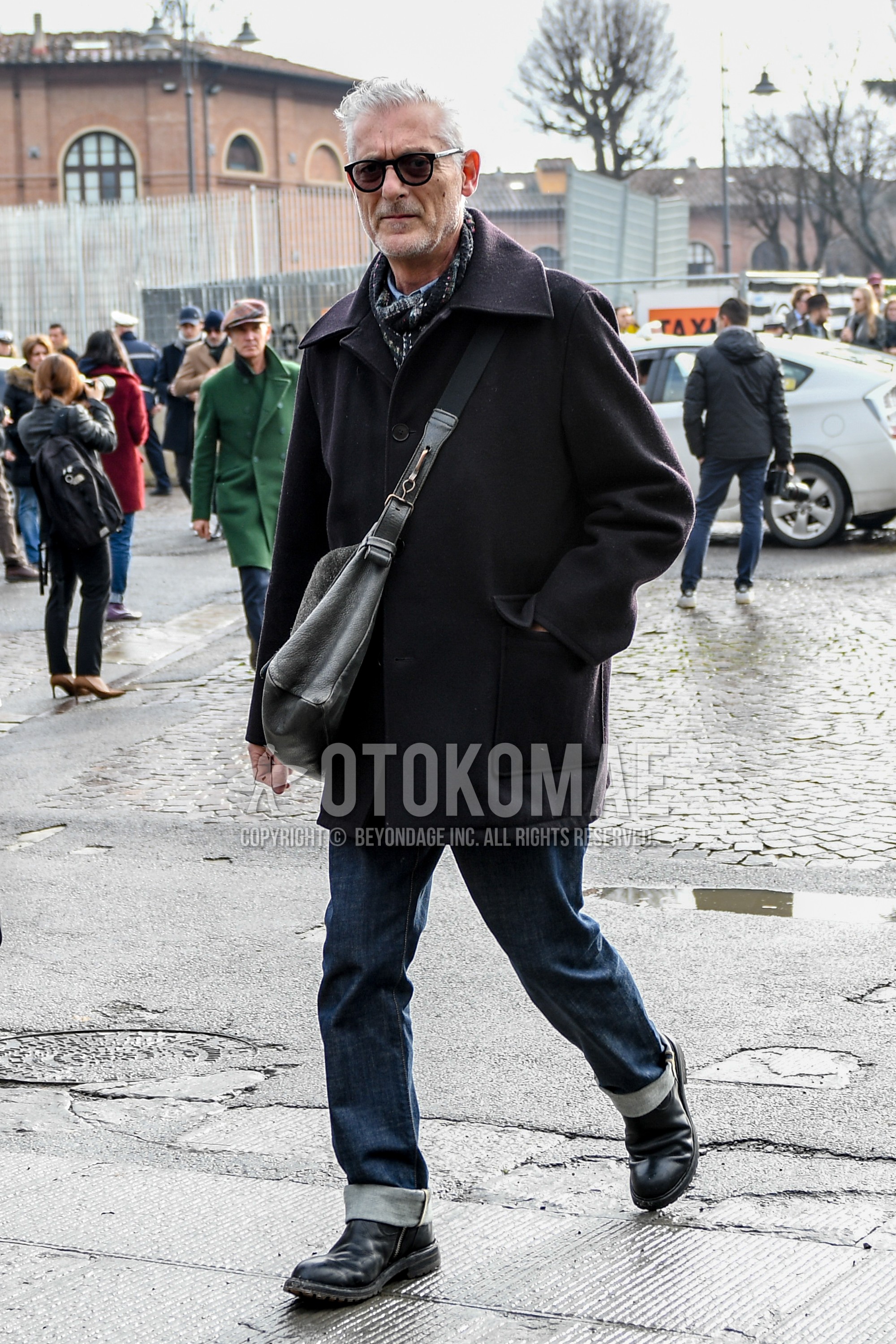 Men's winter outfit with black plain sunglasses, multi-color scarf scarf, black plain stenkarrer coat, blue plain denim/jeans, black  boots, gray plain shoulder bag.