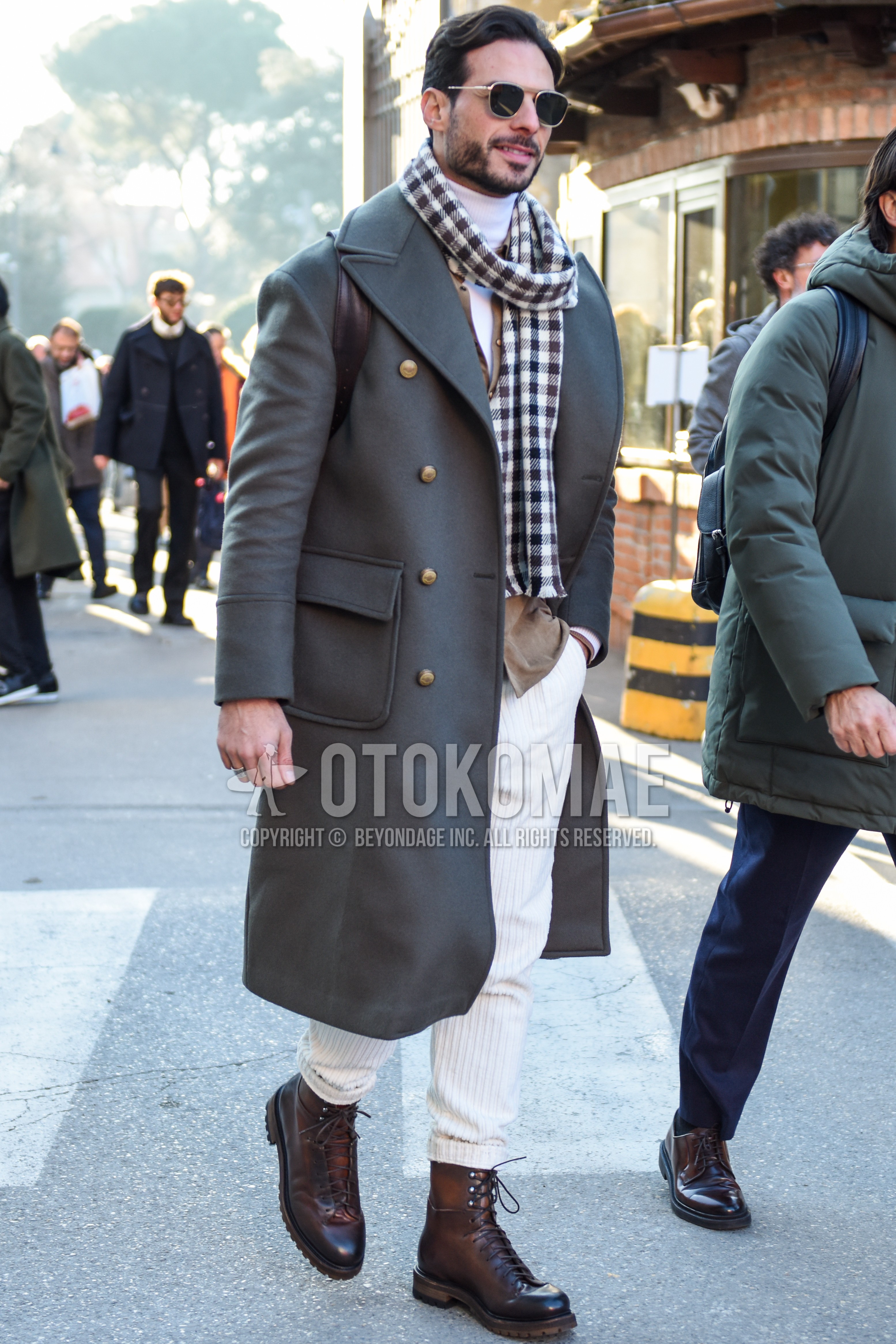 Men's autumn winter outfit with silver plain sunglasses, white black check scarf, gray plain ulster coat, white plain turtleneck knit, white plain winter pants (corduroy,velour), brown  boots.