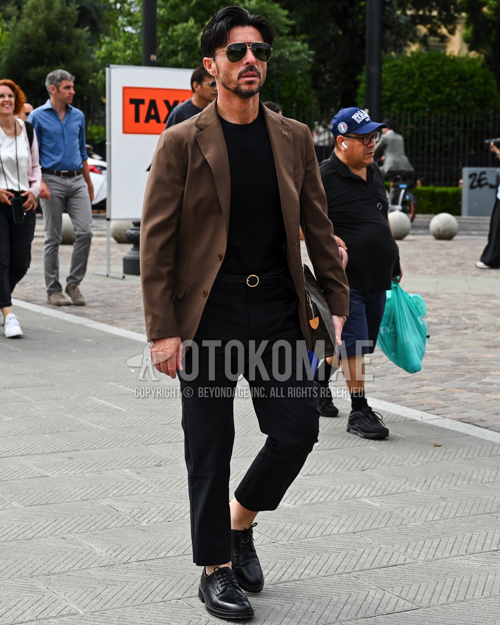 Men's spring summer autumn outfit with black plain sunglasses, brown plain tailored jacket, black plain t-shirt, black plain leather belt, black plain slacks, black plain toe leather shoes.