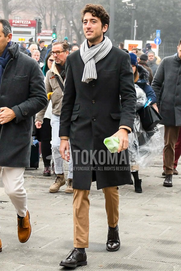 Men's winter outfit with gray plain scarf, dark gray plain chester coat, brown plain slacks, dark gray plain socks, black plain toe leather shoes.