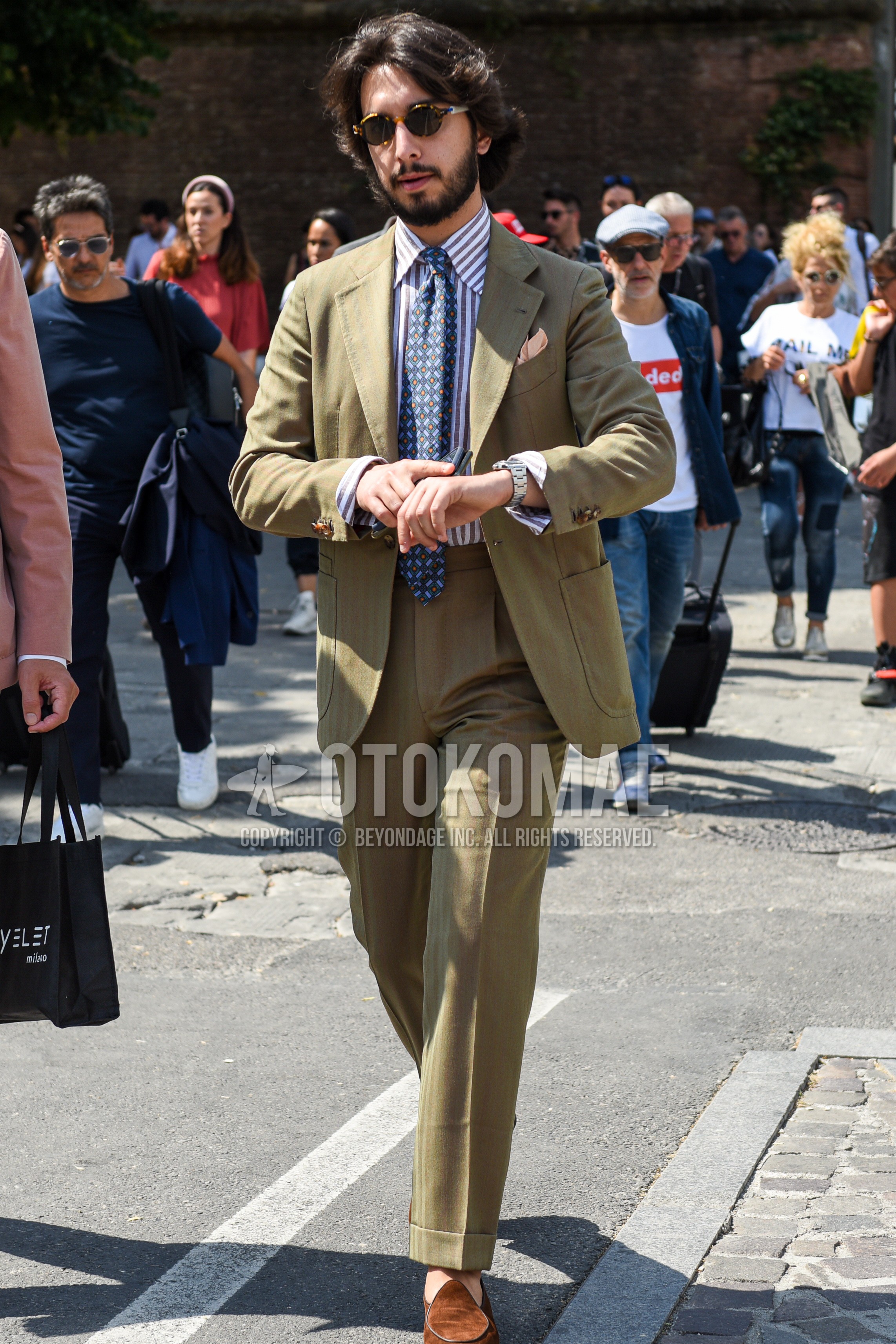 Men's spring autumn outfit with black tortoiseshell sunglasses, white beige stripes shirt, brown  loafers leather shoes, blue necktie necktie.