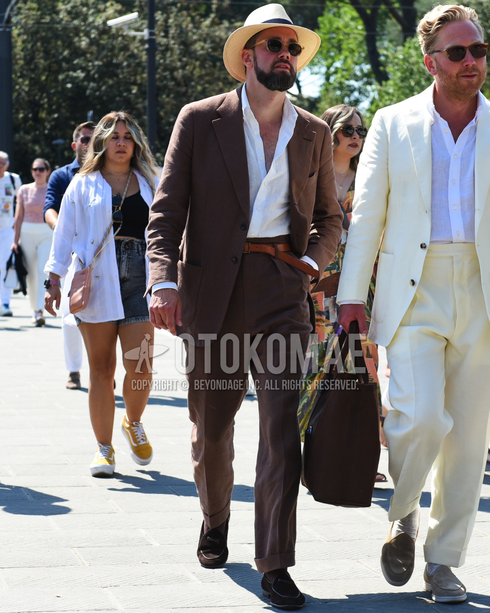 Men's spring summer outfit with beige plain hat, brown clear plain sunglasses, white plain shirt, brown plain leather belt, brown tassel loafers leather shoes, brown plain suit.