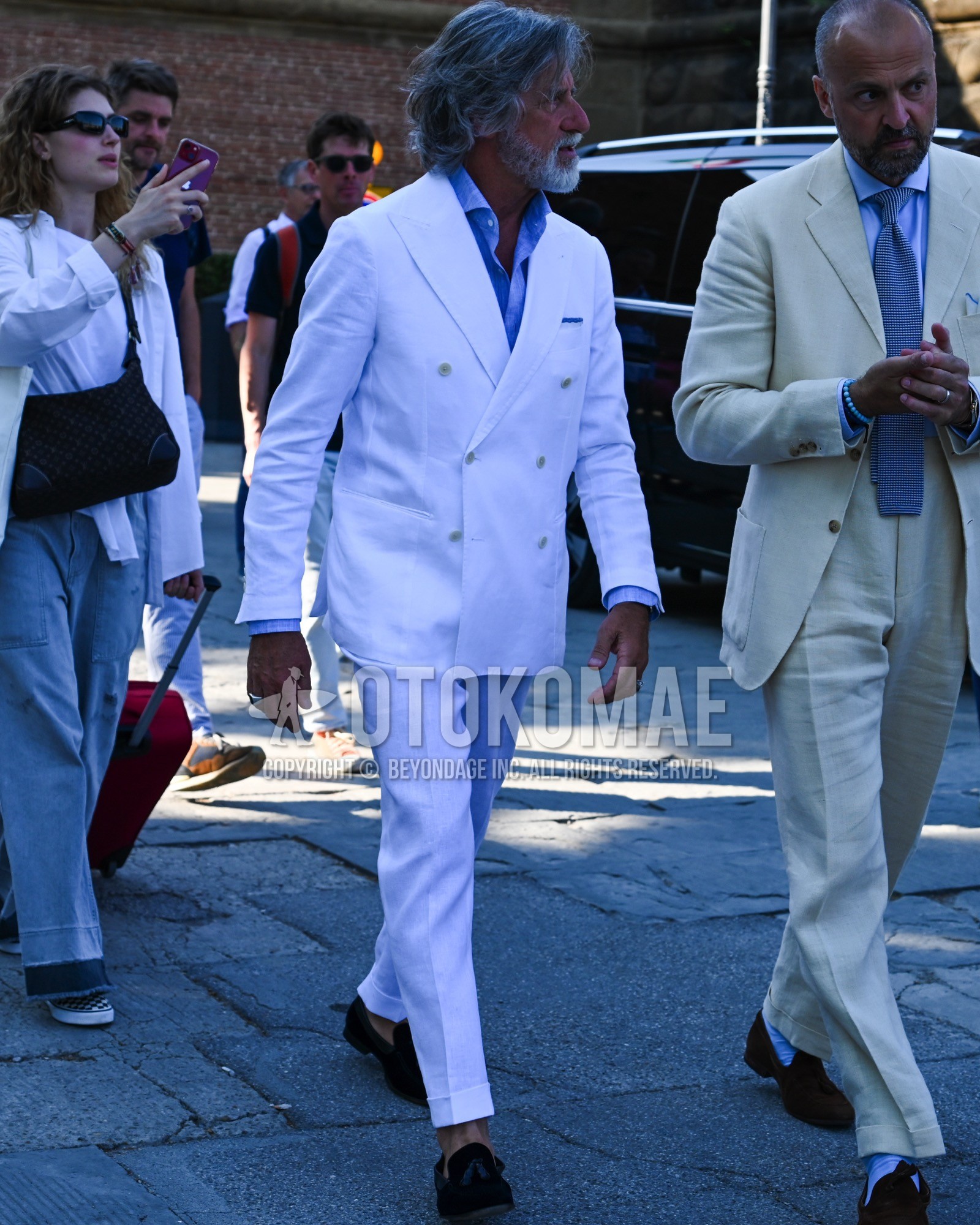 Men's spring summer autumn outfit with light blue plain shirt, brown tassel loafers leather shoes, white plain suit.