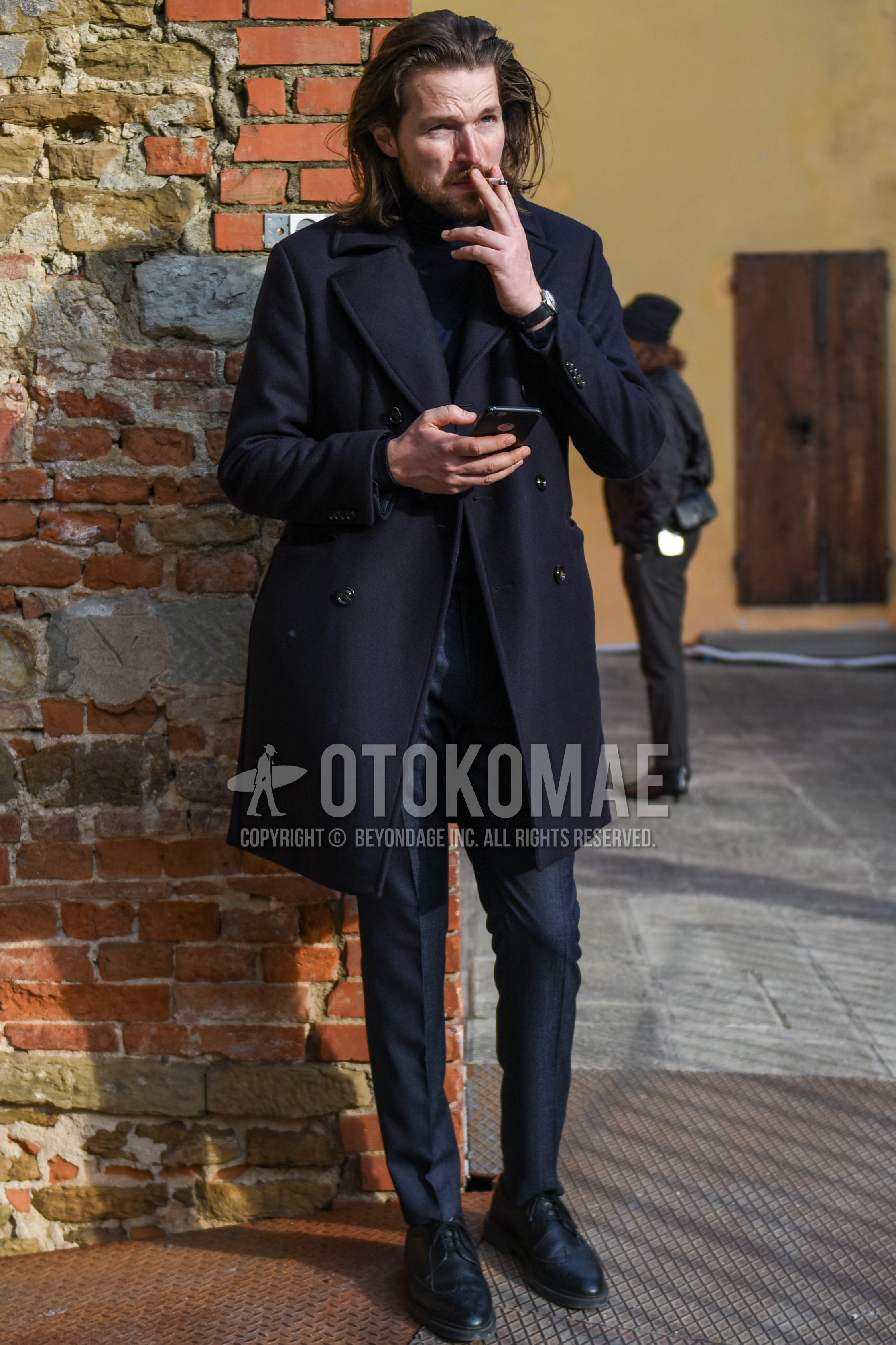 Men's autumn winter outfit with navy plain ulster coat, gray plain slacks, black wing-tip shoes leather shoes.