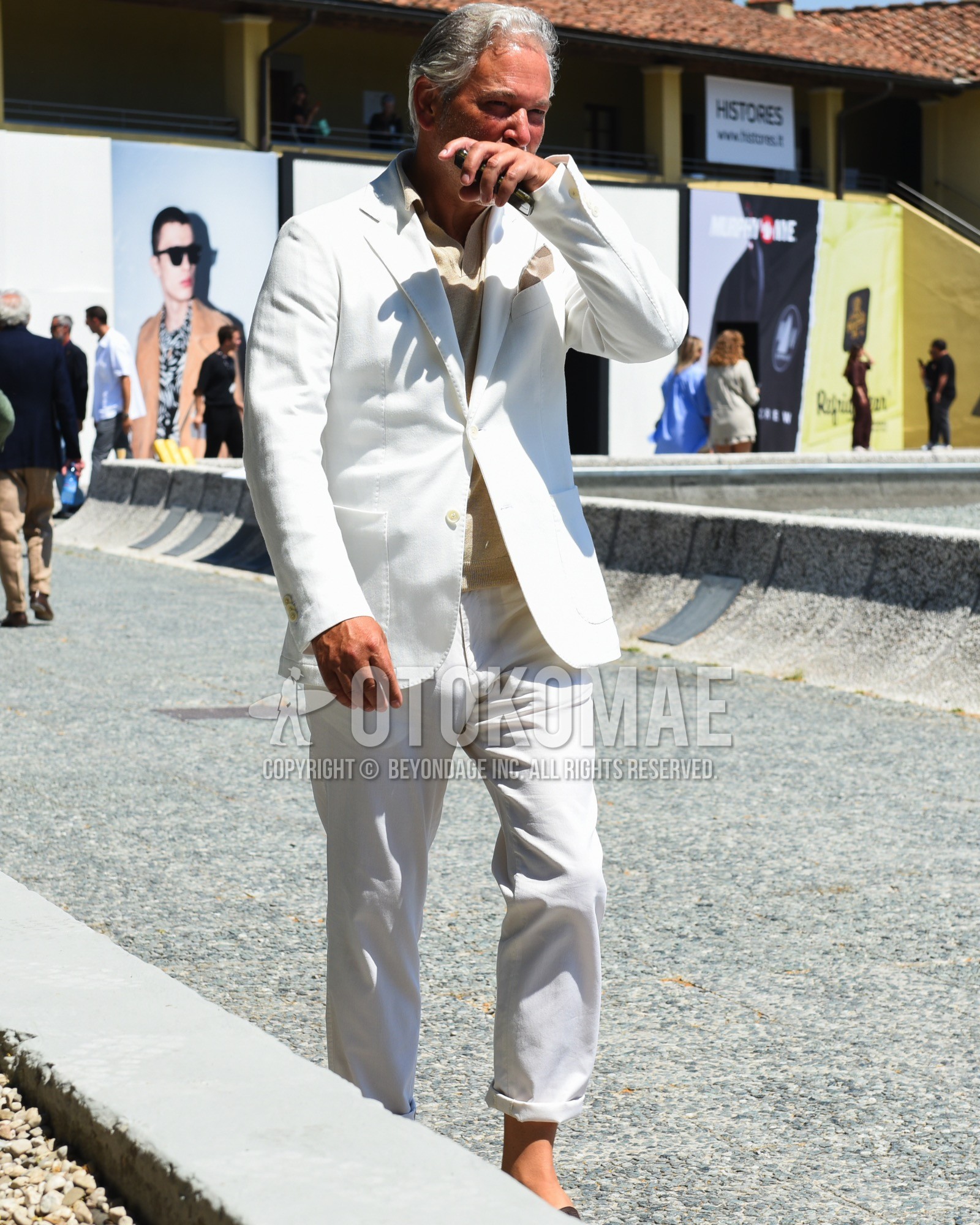 Men's spring summer outfit with beige plain polo shirt, white plain suit.