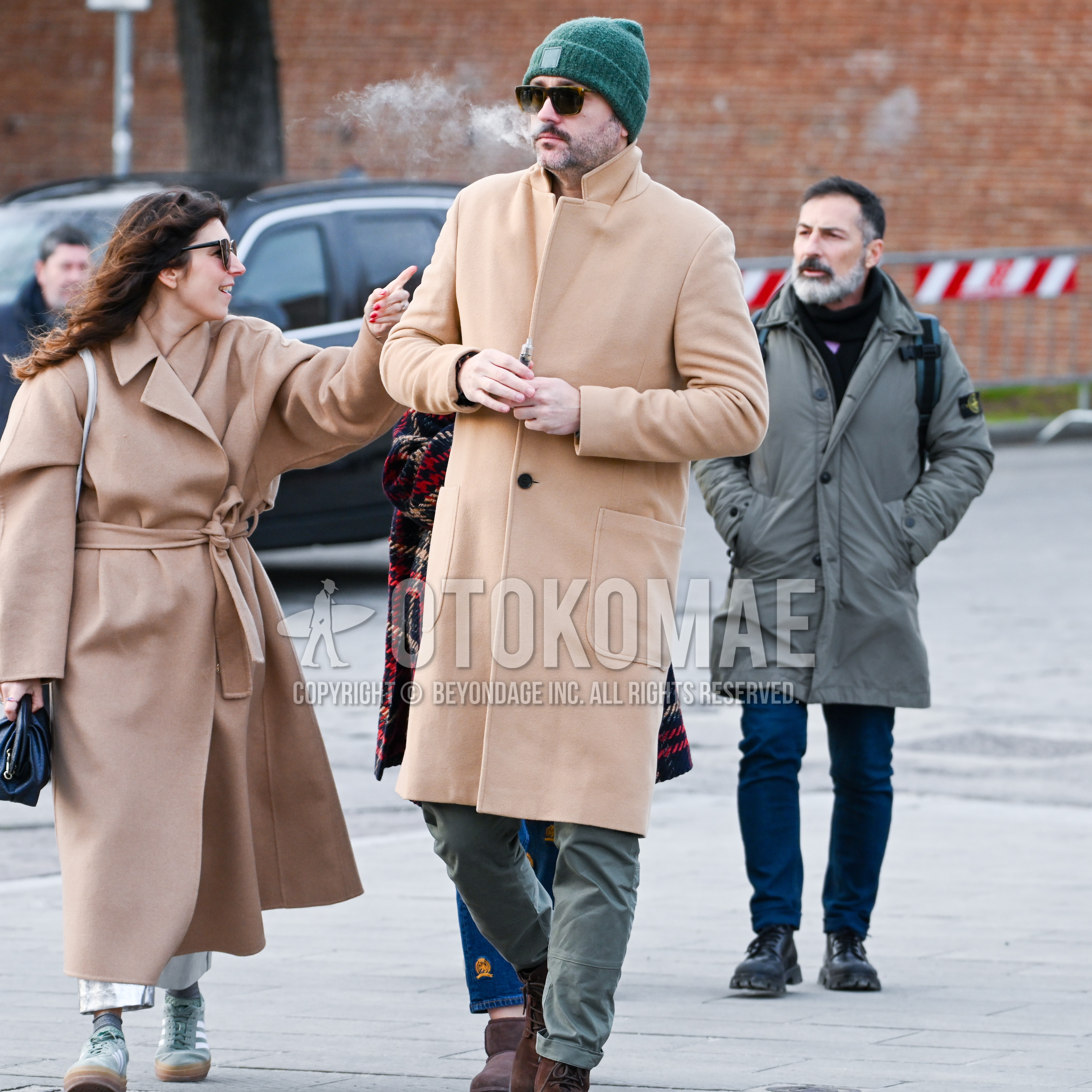 Men's autumn winter outfit with green one point knit cap, beige plain chester coat, olive green plain cotton pants, brown  boots.