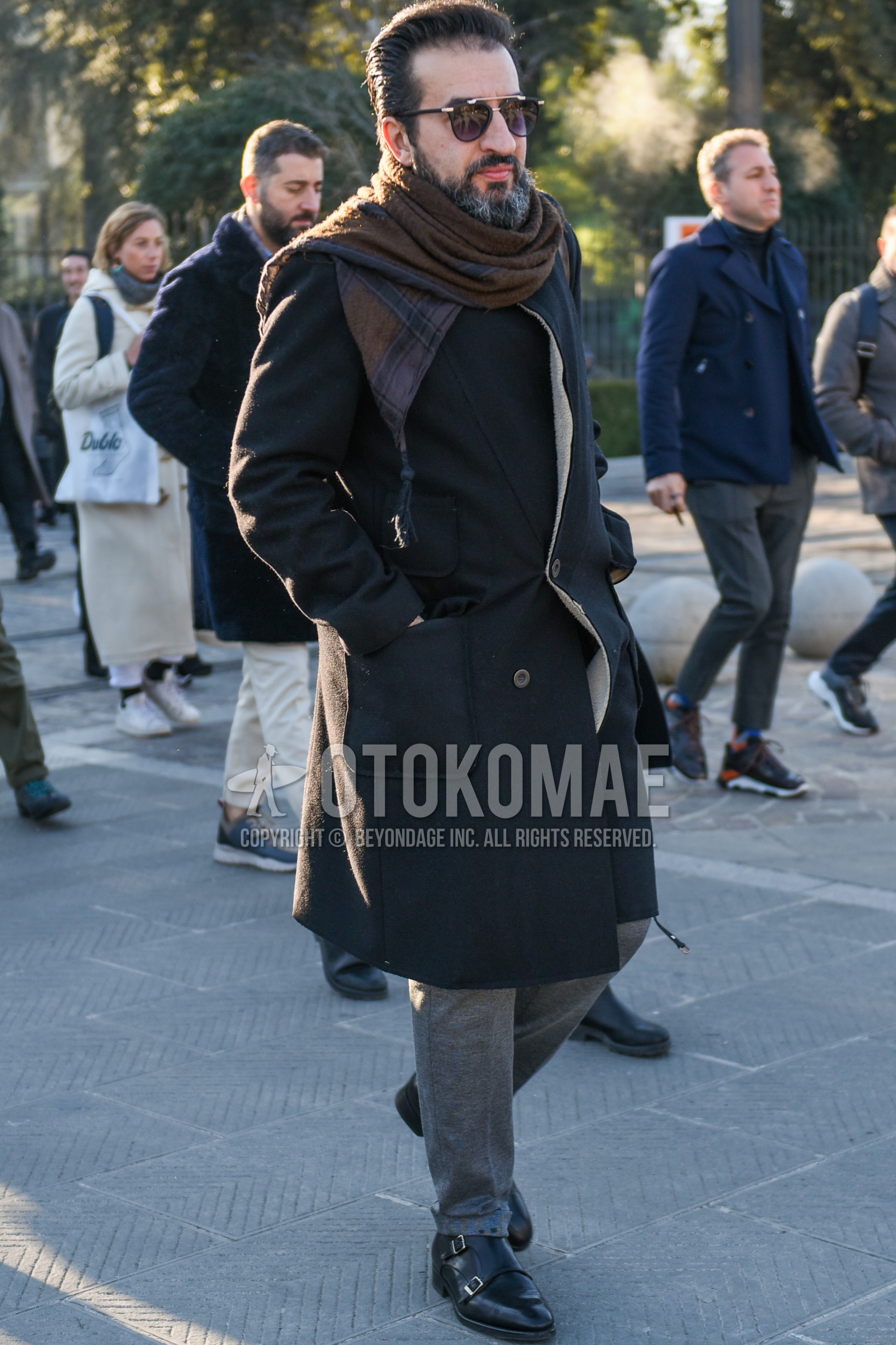 Men's autumn winter outfit with black plain sunglasses, brown scarf scarf, dark gray plain chester coat, gray plain slacks, black monk shoes leather shoes.