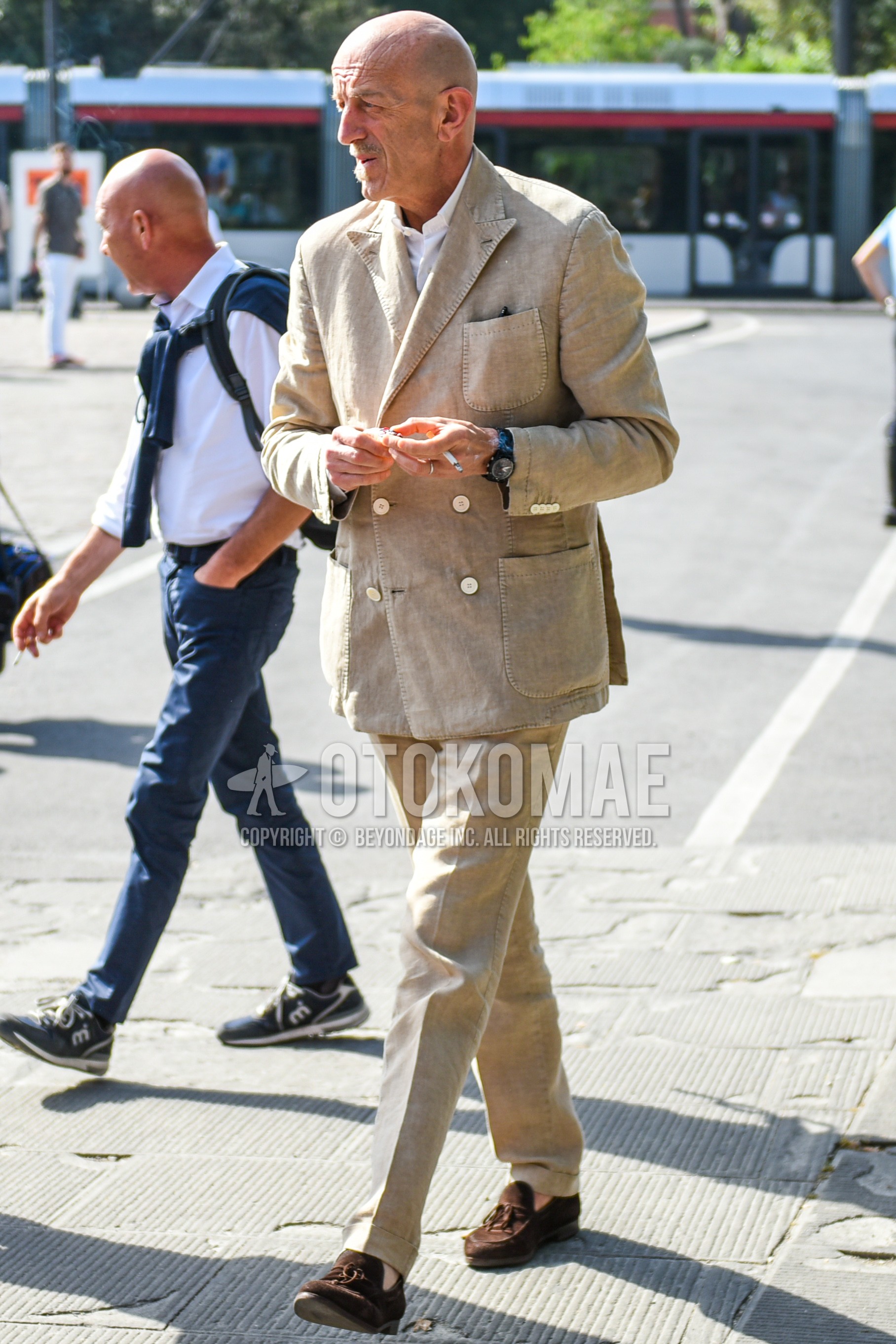 Men's spring autumn outfit with white plain shirt, brown tassel loafers leather shoes, beige plain suit.