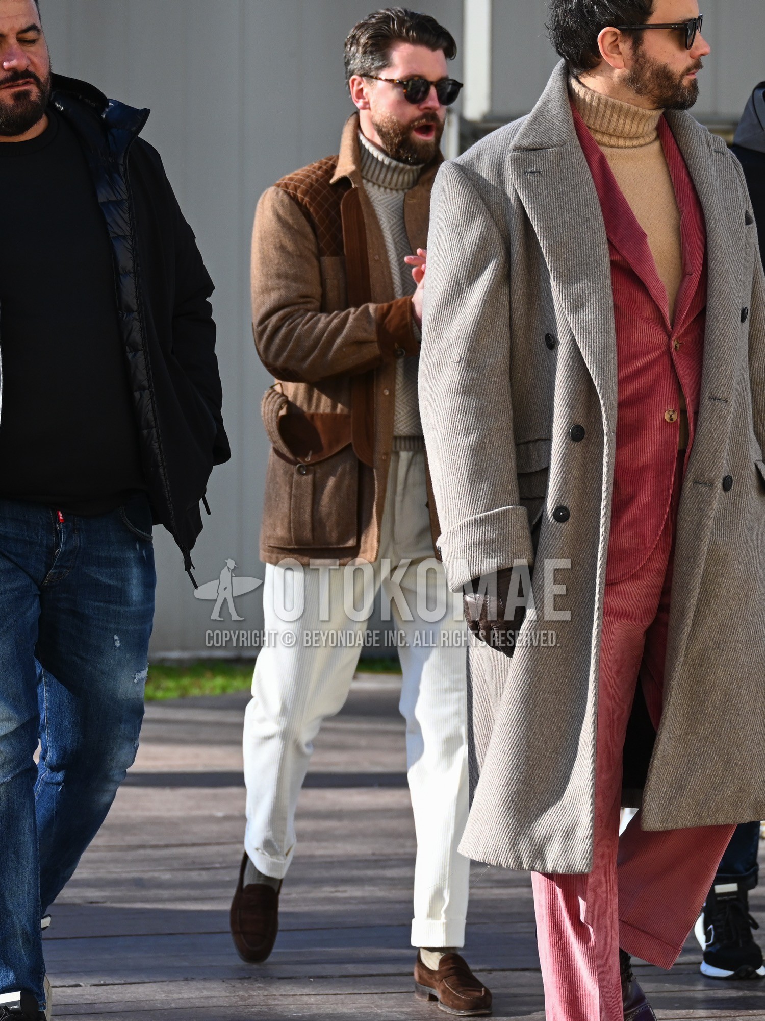 Men's autumn winter outfit with brown tortoiseshell sunglasses, brown beige plain military jacket, beige graphic turtleneck knit, white plain slacks, beige plain socks, brown coin loafers leather shoes, brown suede shoes leather shoes.