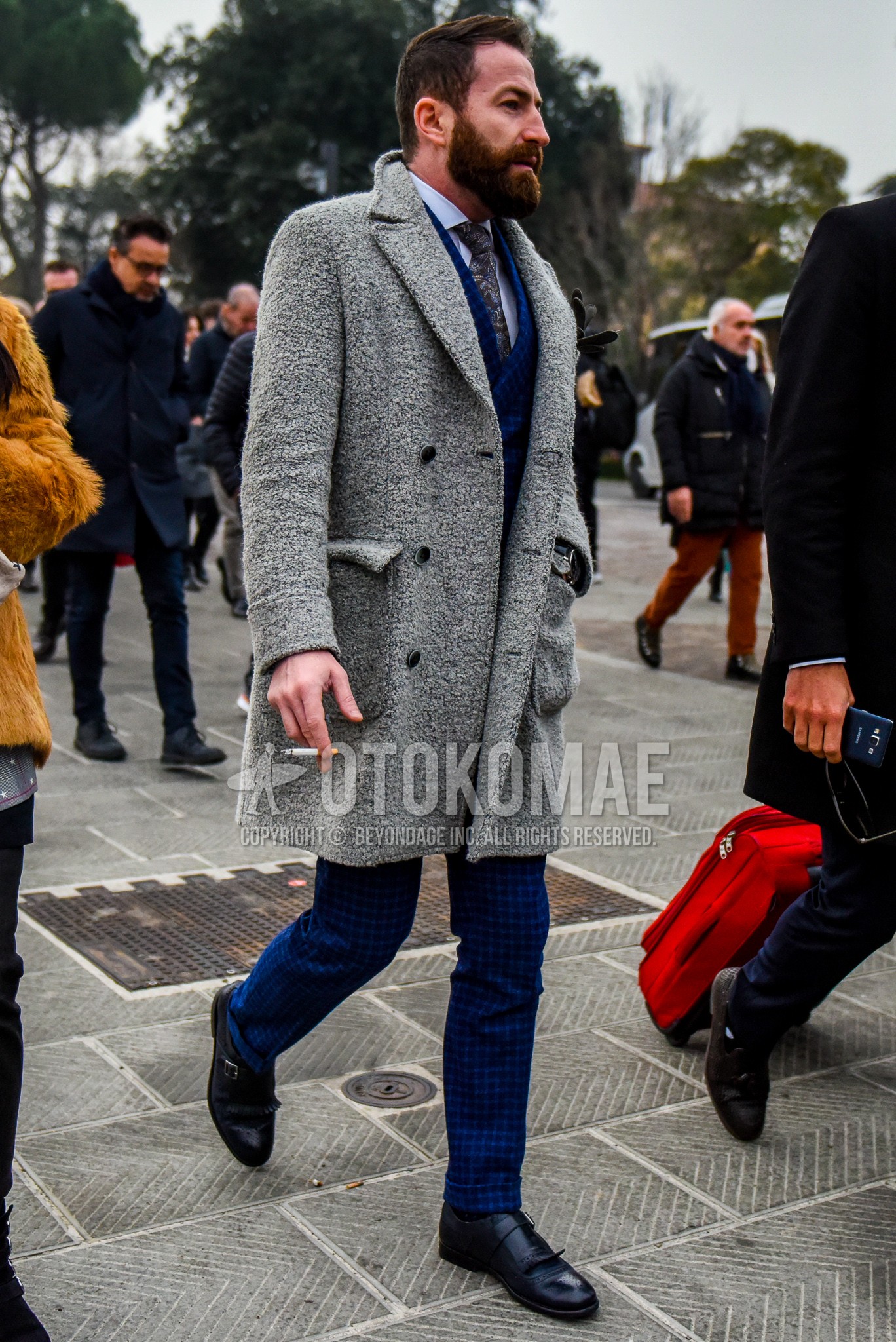 Men's winter outfit with gray plain chester coat, white plain shirt, navy monk shoes leather shoes, blue check suit, brown necktie necktie.