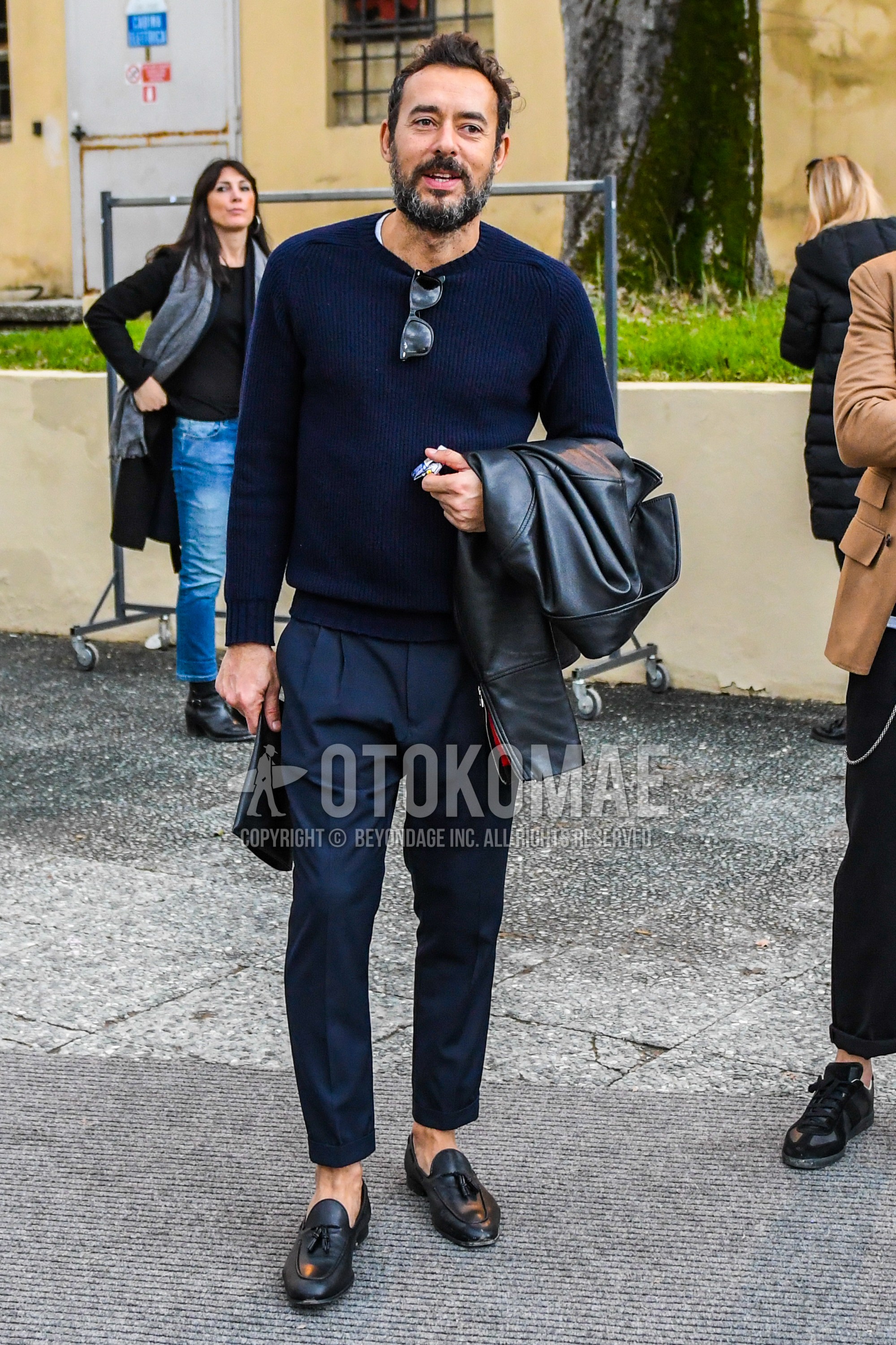 Men's autumn winter outfit with navy plain sweater, navy plain slacks, black tassel loafers leather shoes.
