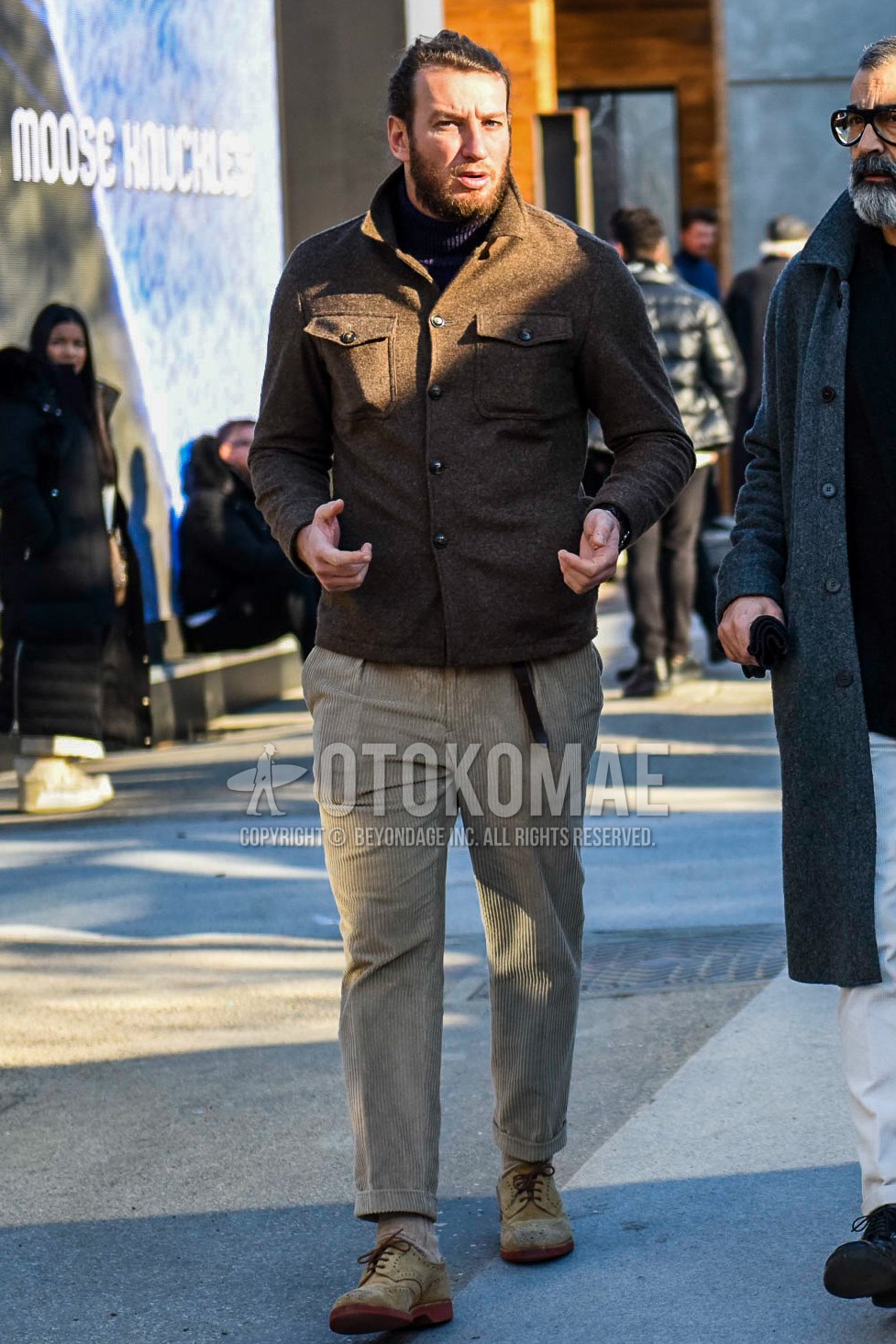 Men's winter outfit with brown plain trucker jacket, black plain turtleneck knit, beige plain winter pants (corduroy,velour), beige plain socks, brown suede shoes leather shoes.