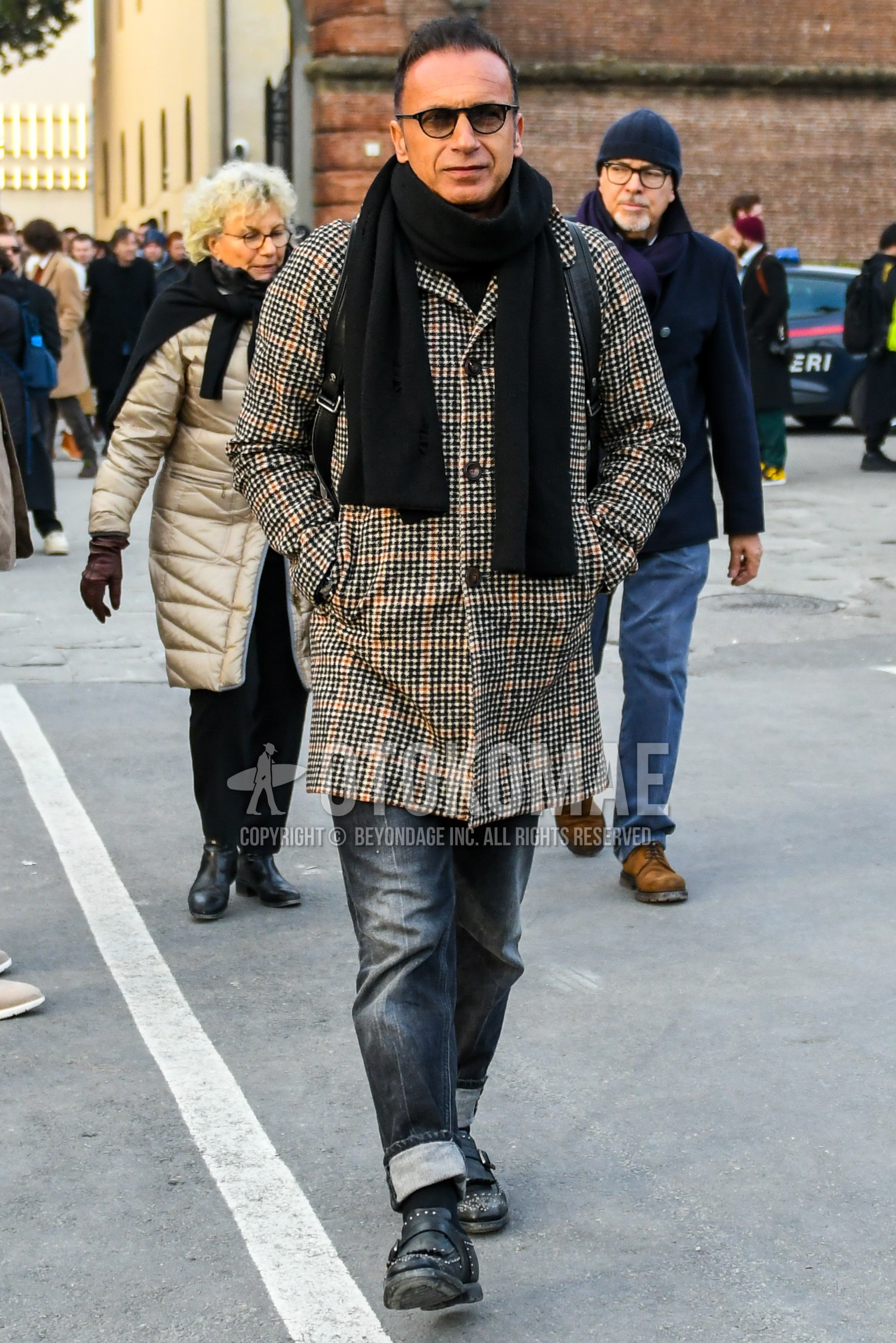 Men's winter outfit with black plain sunglasses, black plain scarf, brown check stenkarrer coat, dark gray plain denim/jeans, black plain socks, black monk shoes leather shoes.