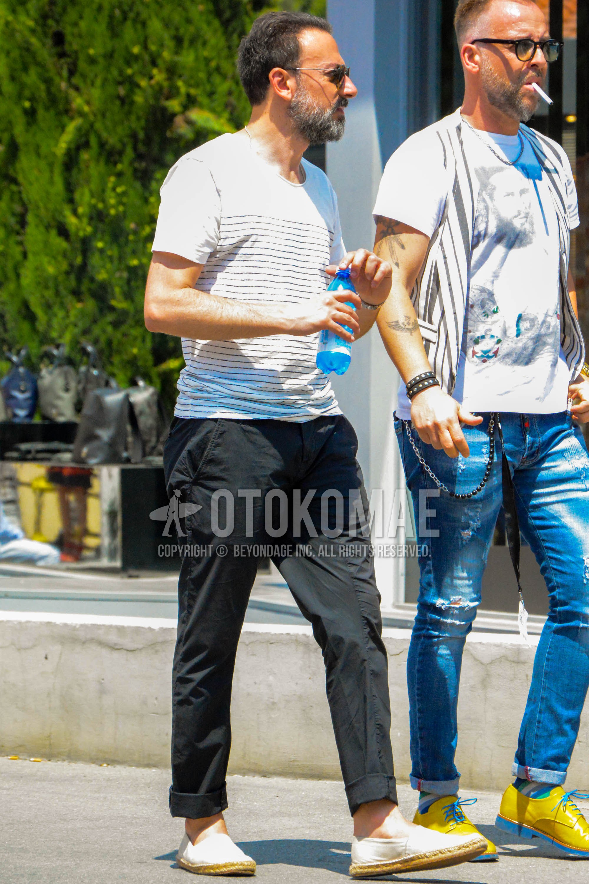 Men's summer outfit with white horizontal stripes t-shirt, black plain cotton pants, white plain espadrille.
