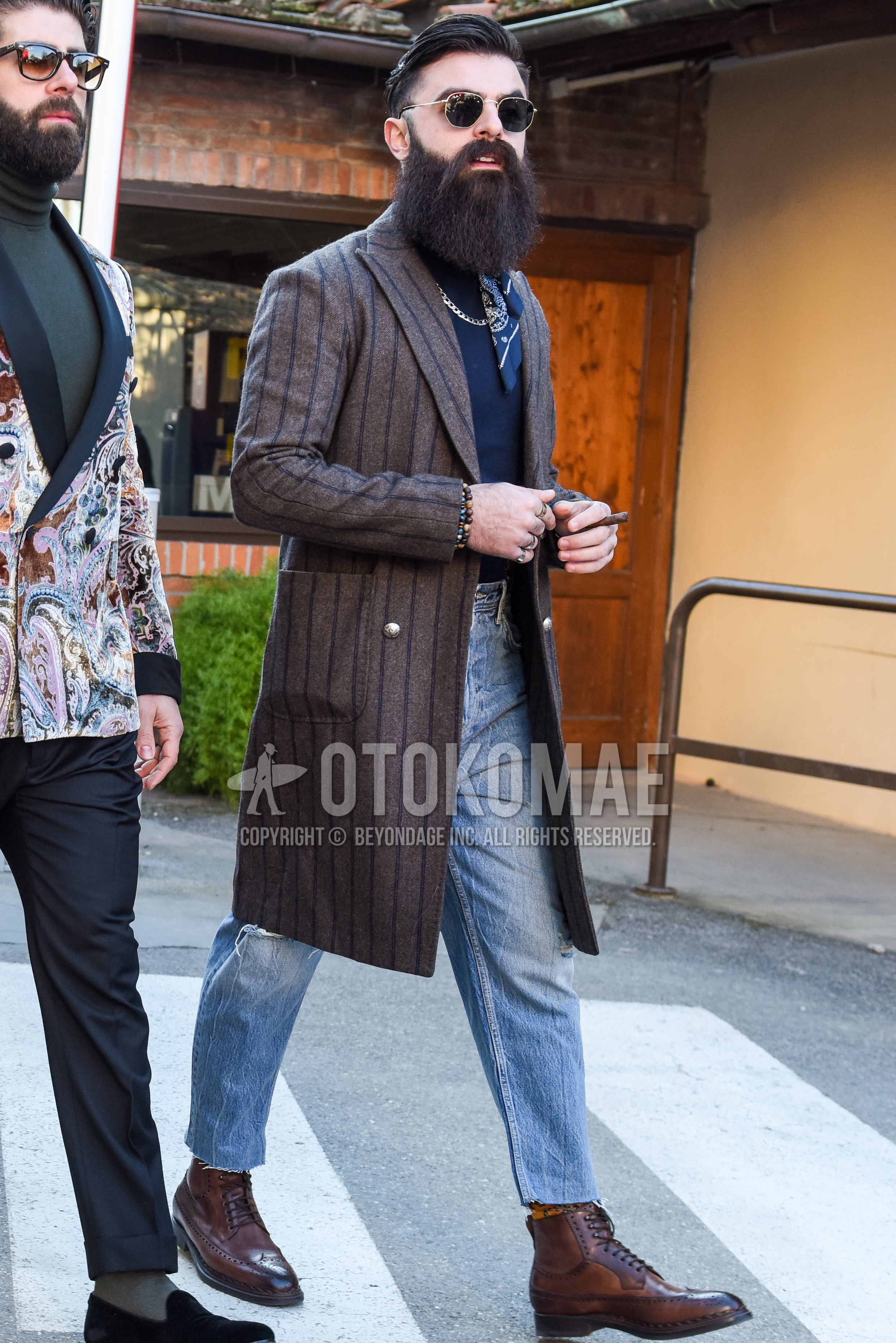 Men's autumn winter outfit with silver plain sunglasses, gray stripes chester coat, navy plain turtleneck knit, light blue plain denim/jeans, light blue plain cropped pants, orange plain socks, brown  boots.