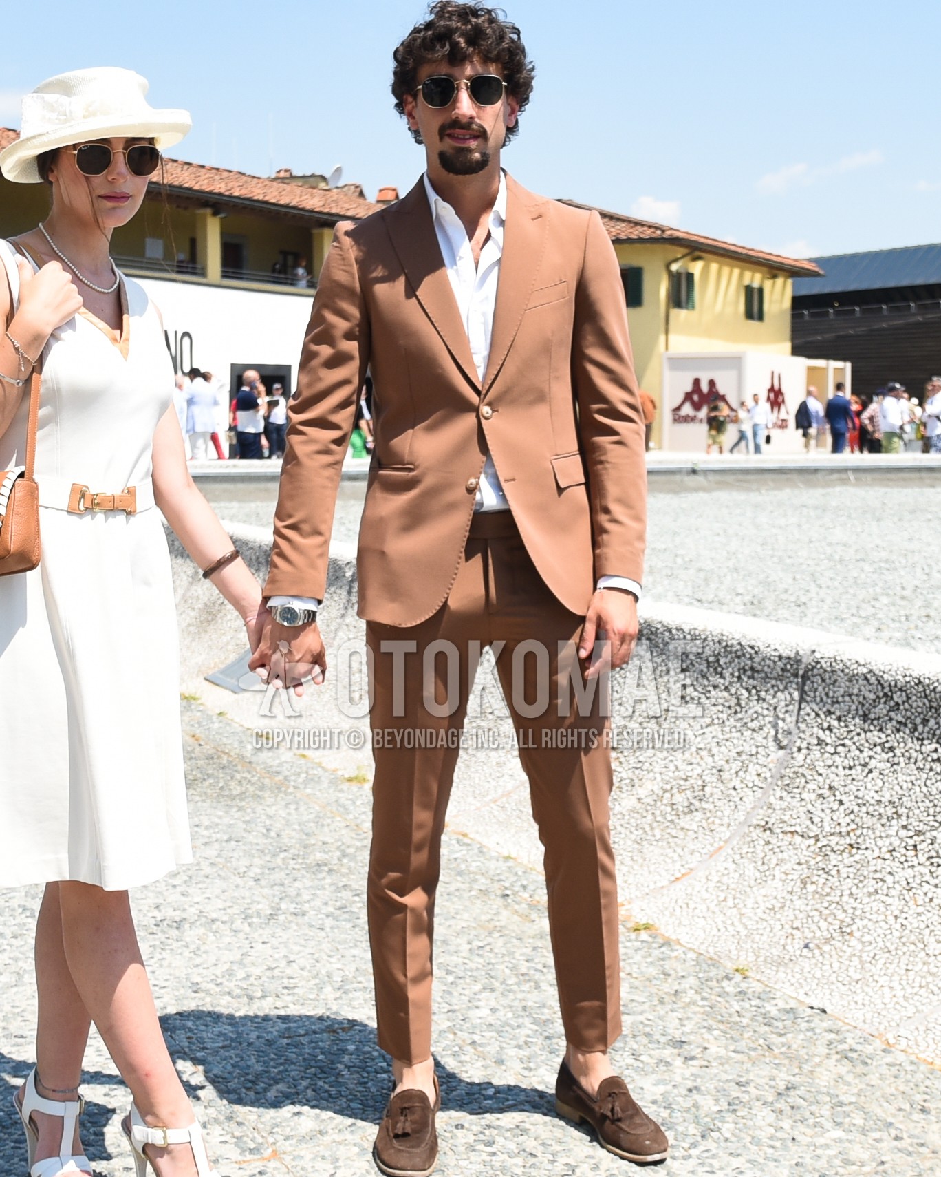 Men's spring summer autumn outfit with silver plain sunglasses, white plain shirt, brown tassel loafers leather shoes, brown plain suit.