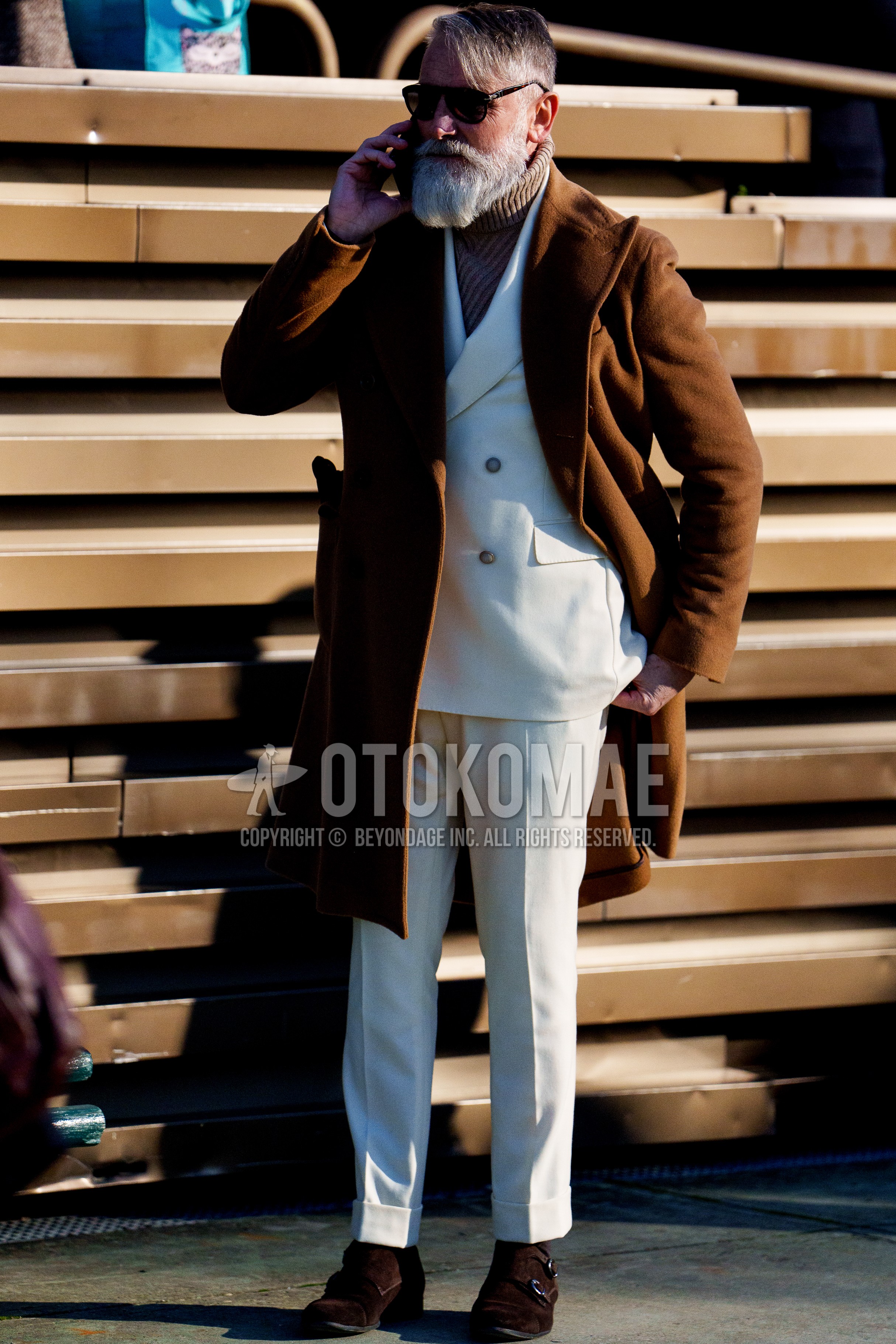 Men's spring winter outfit with black plain sunglasses, brown plain chester coat, brown plain turtleneck knit, brown suede shoes leather shoes, white plain suit.