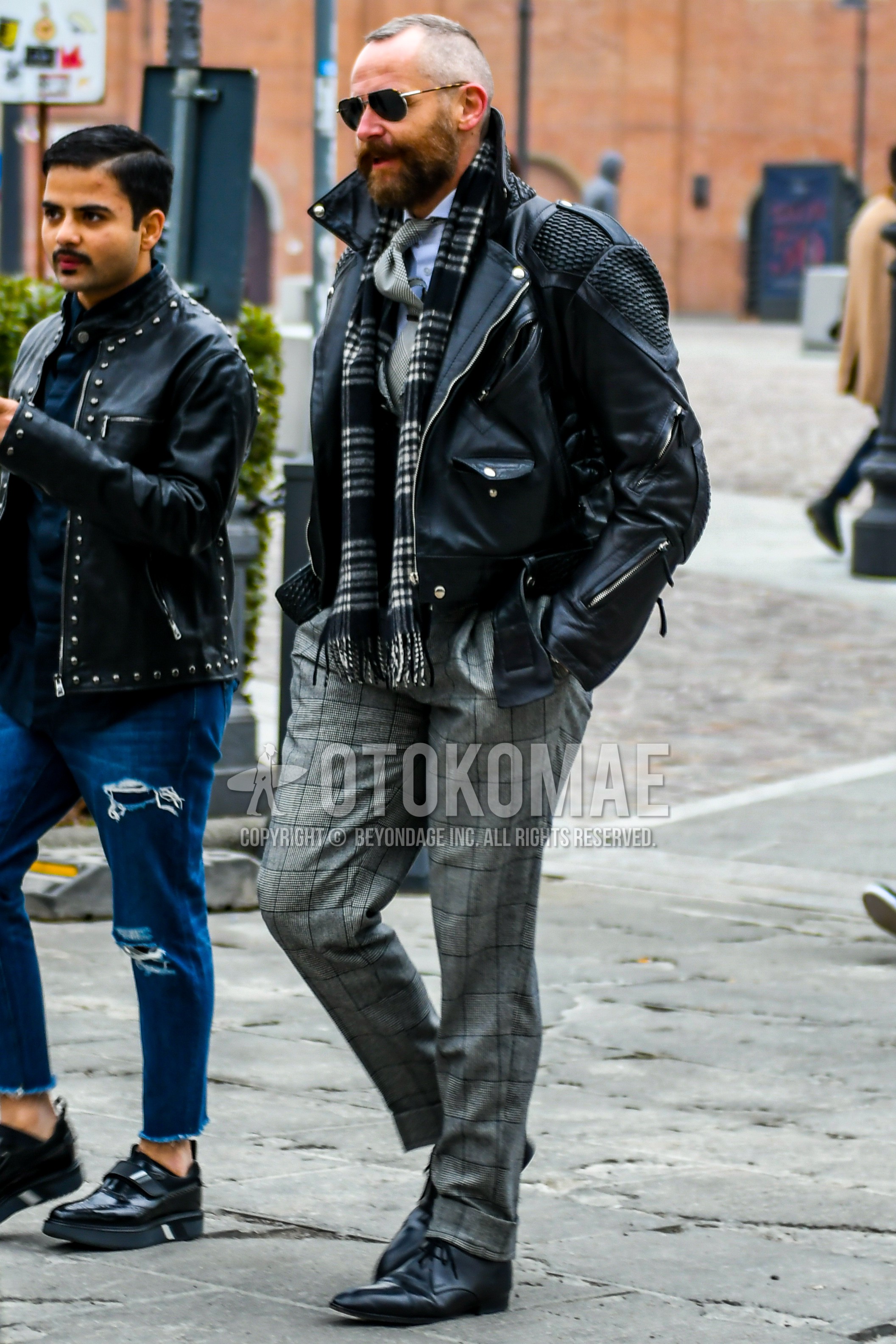 Men's winter outfit with plain sunglasses, black check scarf, black plain riders jacket, gray check slacks, black plain toe leather shoes, gray plain necktie.