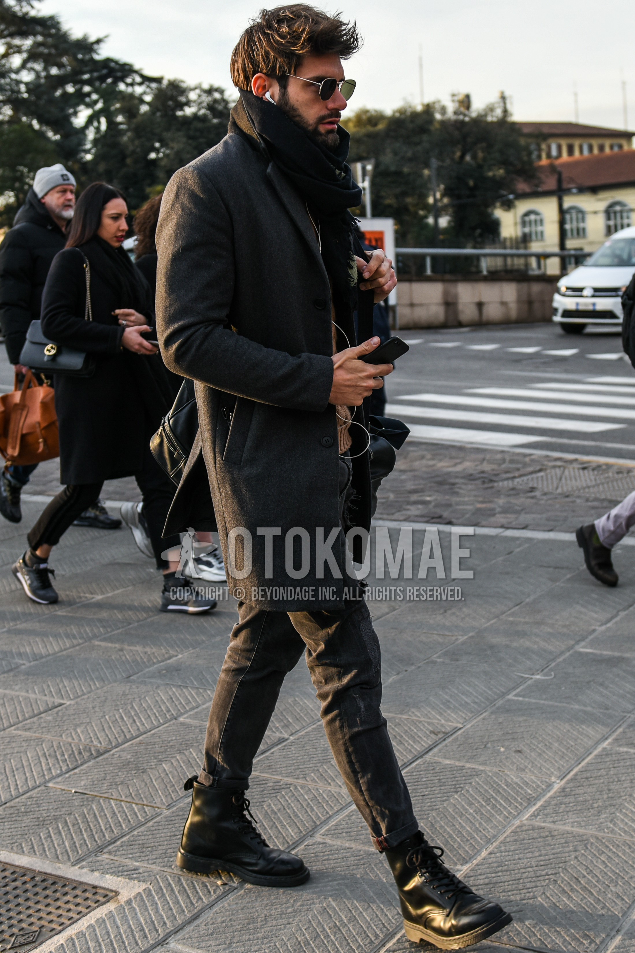Men's autumn winter outfit with silver plain sunglasses, black plain scarf, gray plain chester coat, gray plain denim/jeans, black  boots.