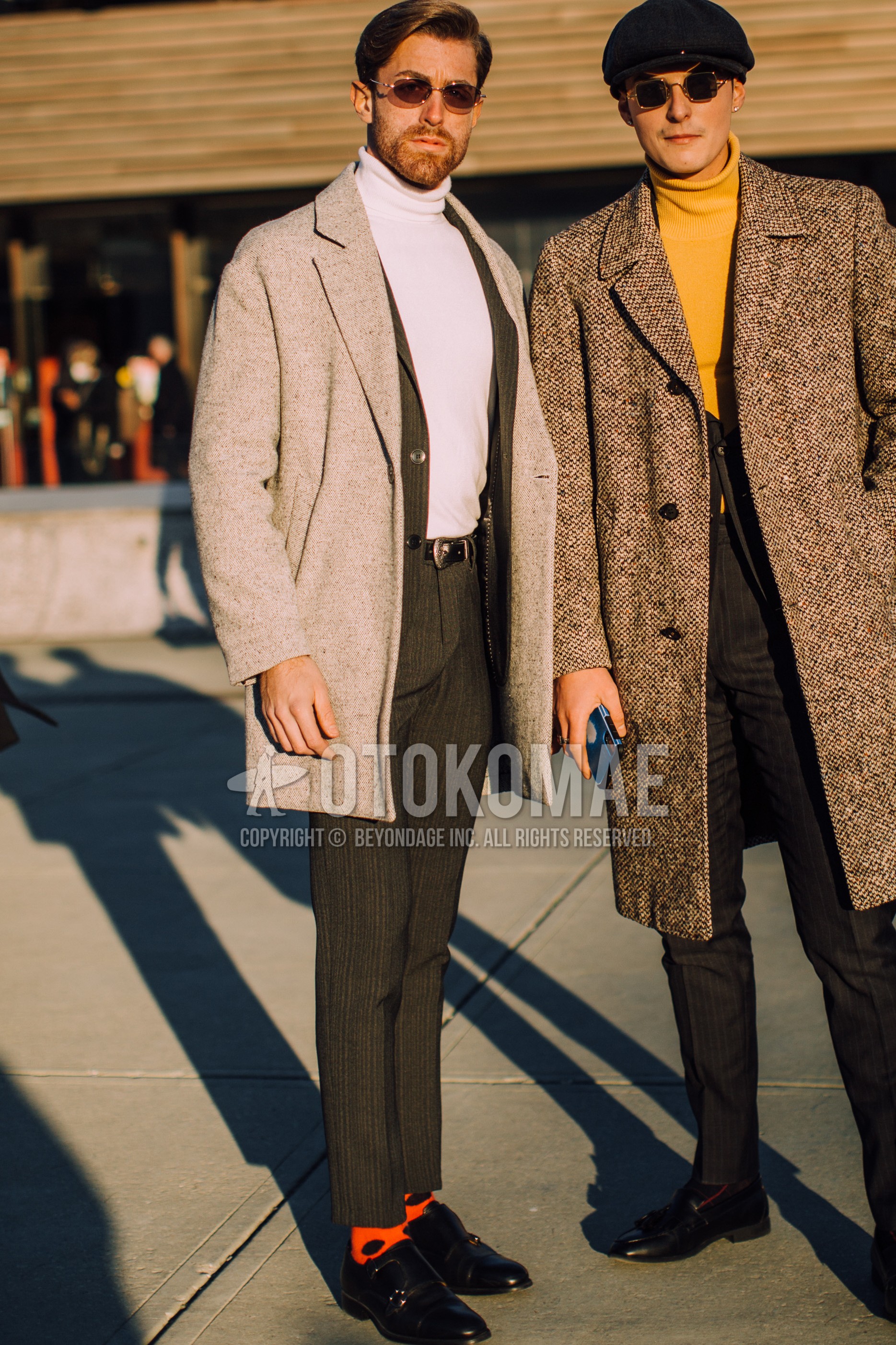 Men's autumn winter outfit with silver plain sunglasses, gray plain chester coat, white plain turtleneck knit, black plain leather belt, orange dots socks, black monk shoes leather shoes, dark gray stripes suit.