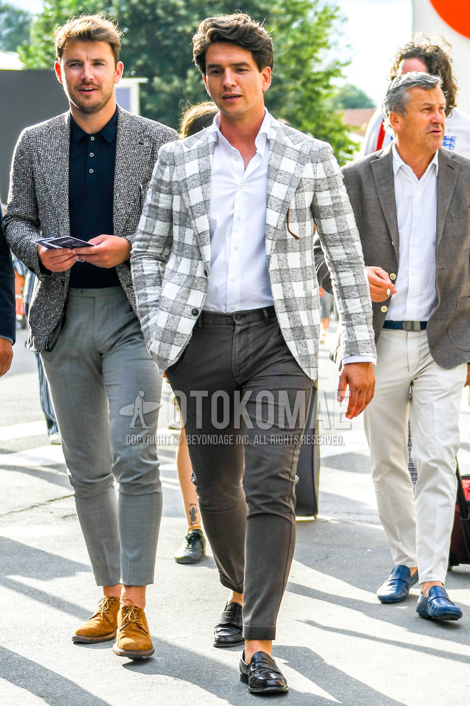 Men's spring summer autumn outfit with white gray check tailored jacket, white plain shirt, gray plain cotton pants, black coin loafers leather shoes.