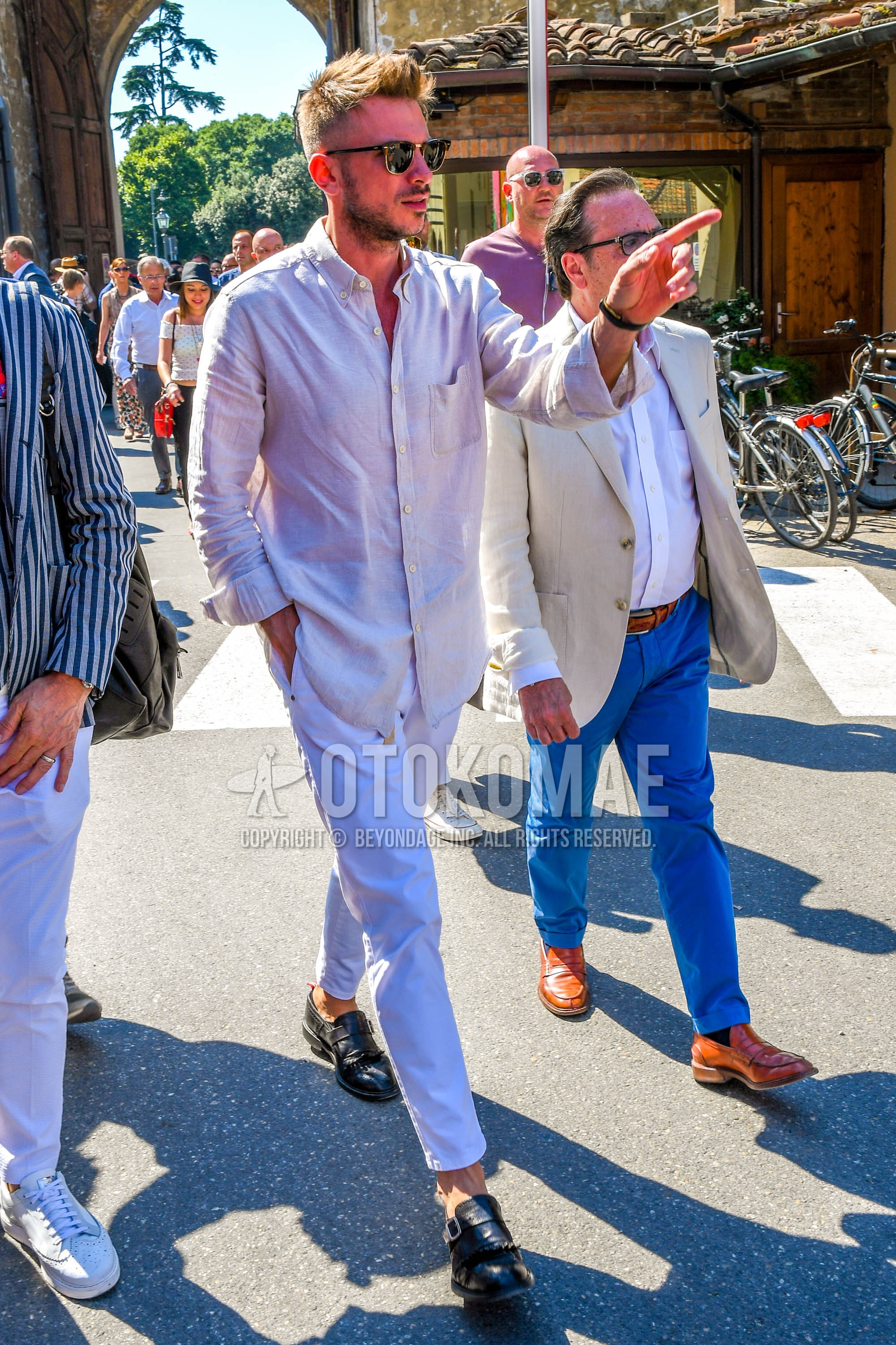 Men's spring summer outfit with plain sunglasses, beige plain shirt, white plain cotton pants, plain cropped pants, black monk shoes leather shoes.